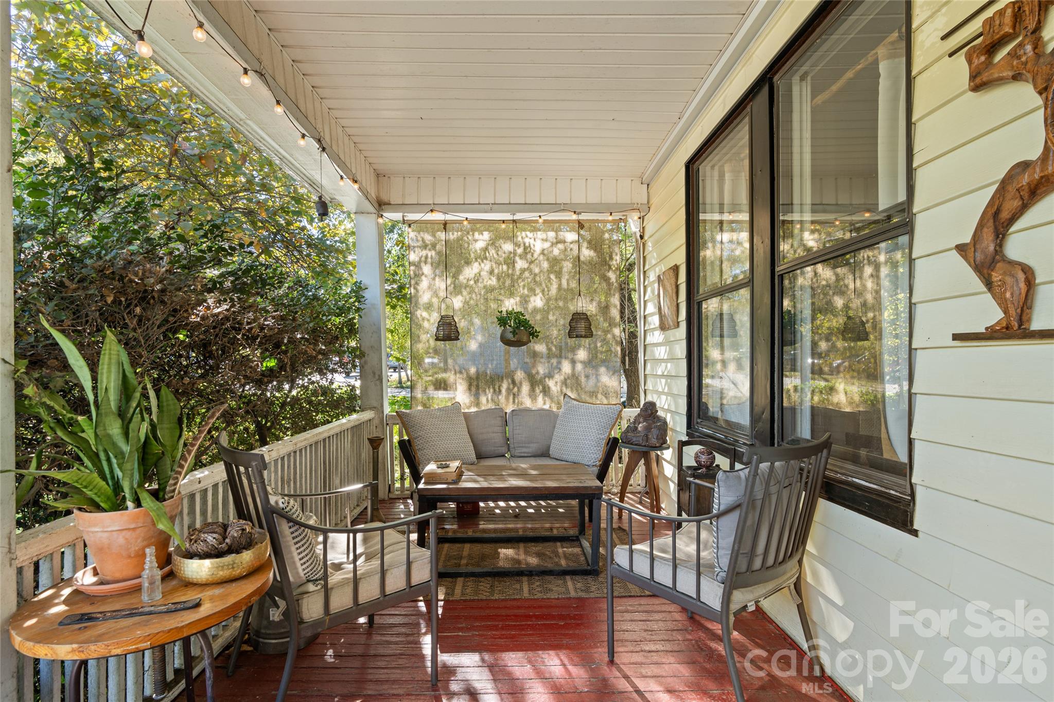 Foliage gives the front porch a real sense of privacy. - 77 Cherry Street, Asheville