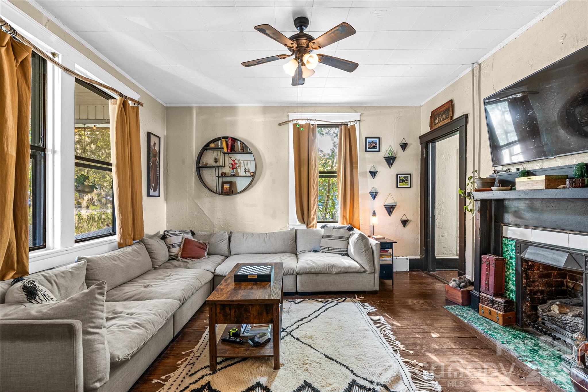 Spacious main level living area with original fireplace. - 77 Cherry Street, Asheville