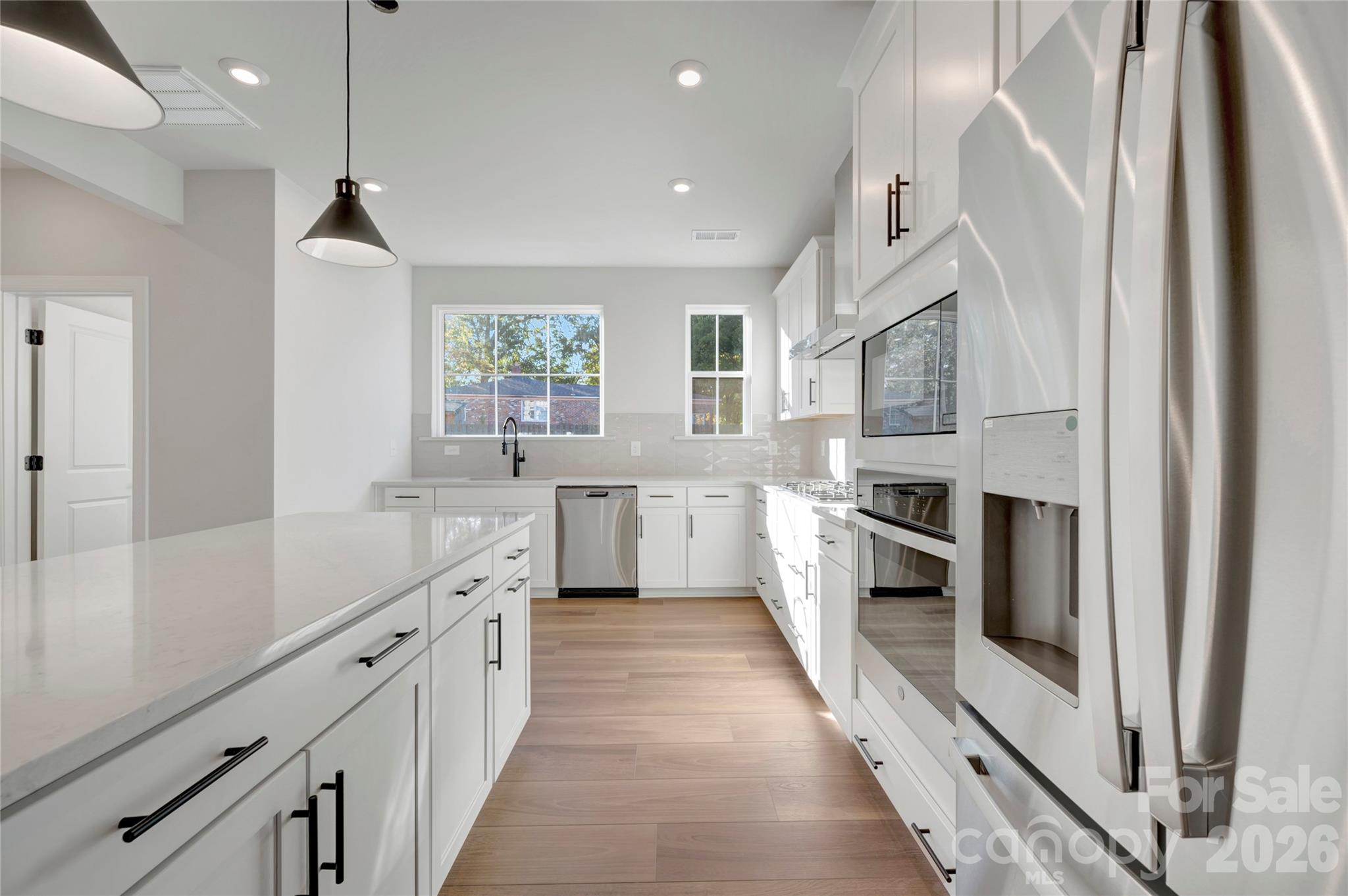Light filled gourmet kitchen with included appliances - 240 Old Town Village Road, Waxhaw