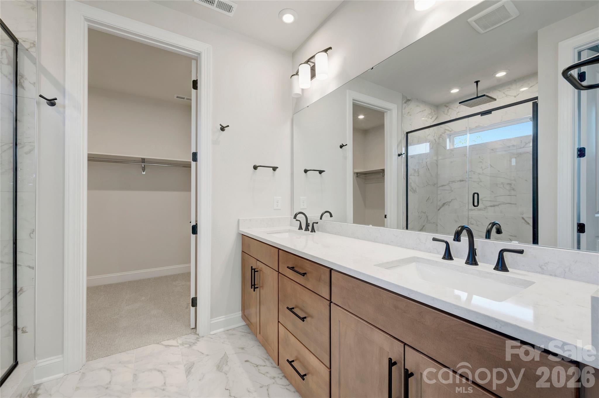 Dual vanity primary bathroom with a walk-in closet - 240 Old Town Village Road, Waxhaw