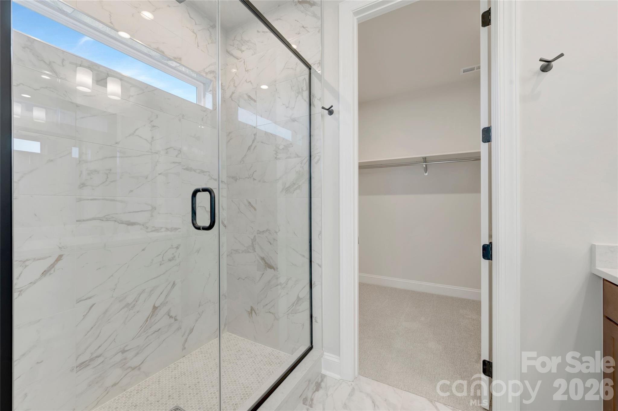 Primary tiled walk-in shower with window - 240 Old Town Village Road, Waxhaw