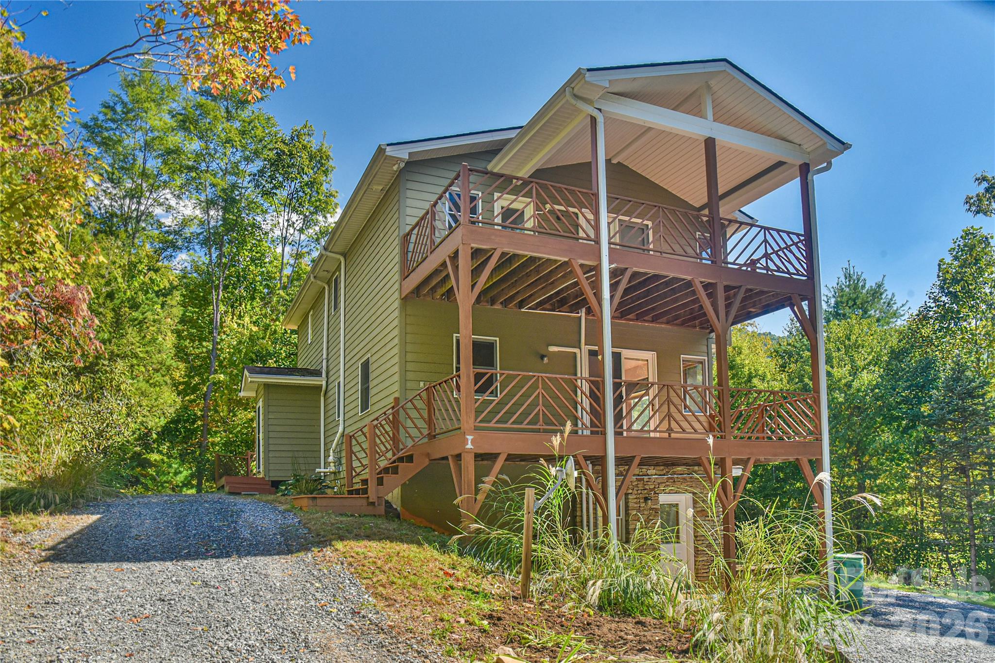 On the main level deck, please find the lockbox. It is located on the floor to the right of the main level entry door. Check Showing Time for details on how to operate lock. - 227 David Ridge Road, Black Mountain