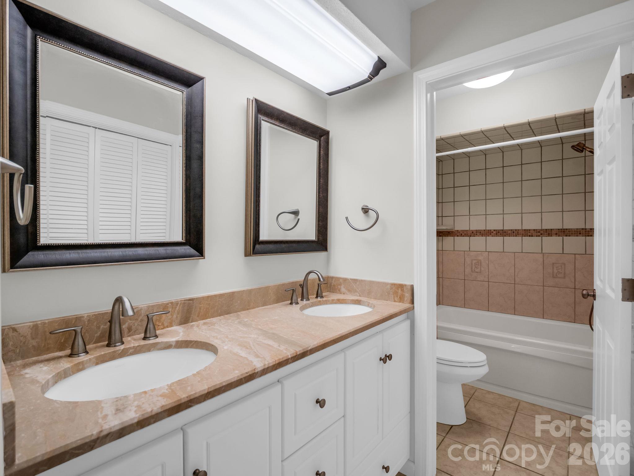 Primary Bath with double sinks and closet - 2630 Seminole Drive, Hendersonville