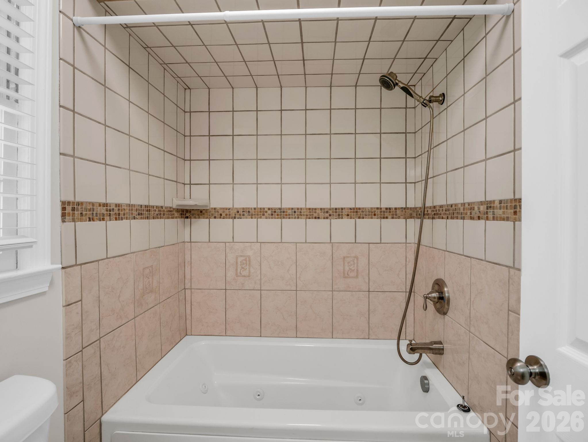 Primary Bath with jetted soaking tub/shower combo - 2630 Seminole Drive, Hendersonville