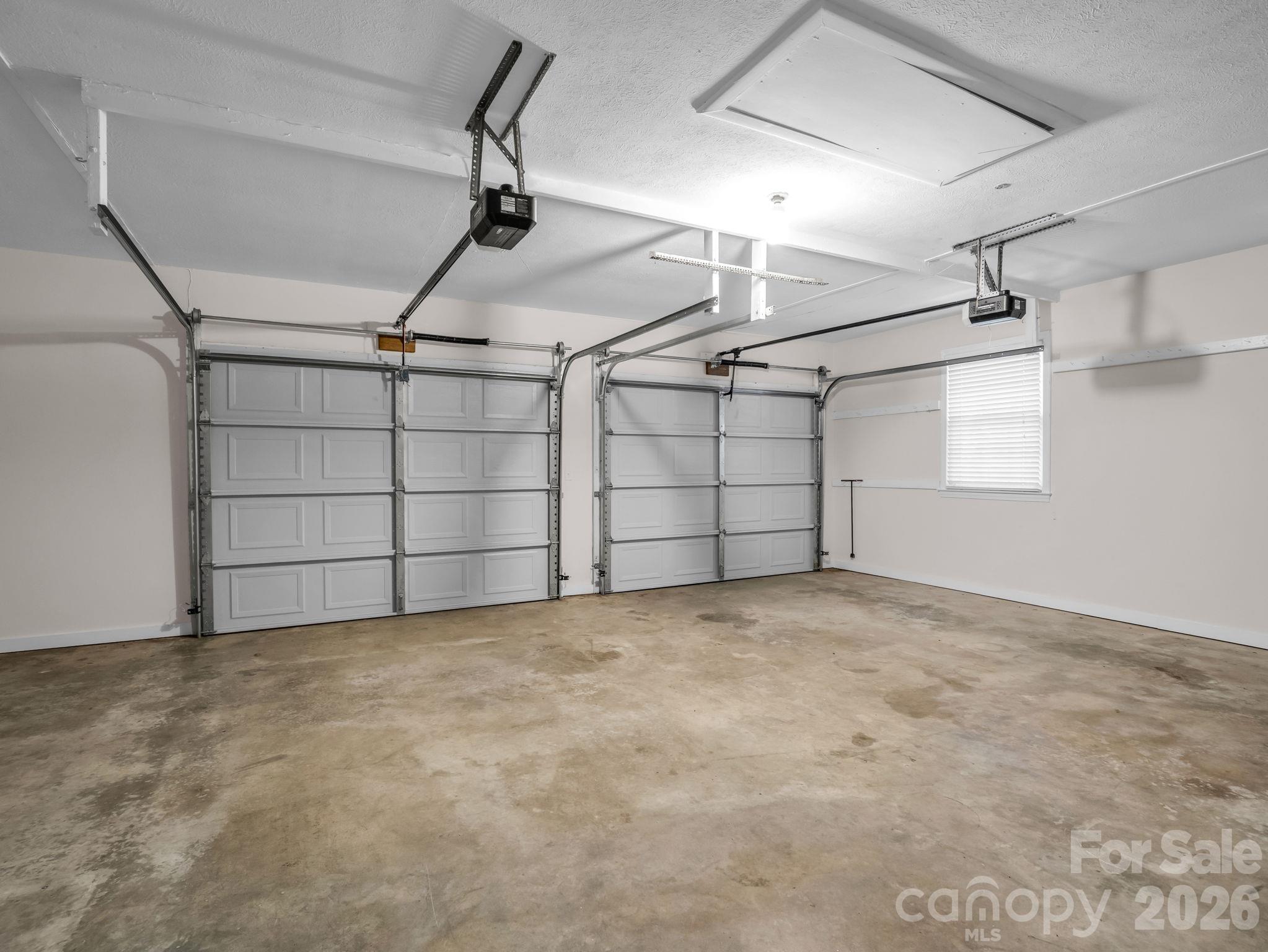 Spacious two car garage with NEW garage doors - 2630 Seminole Drive, Hendersonville