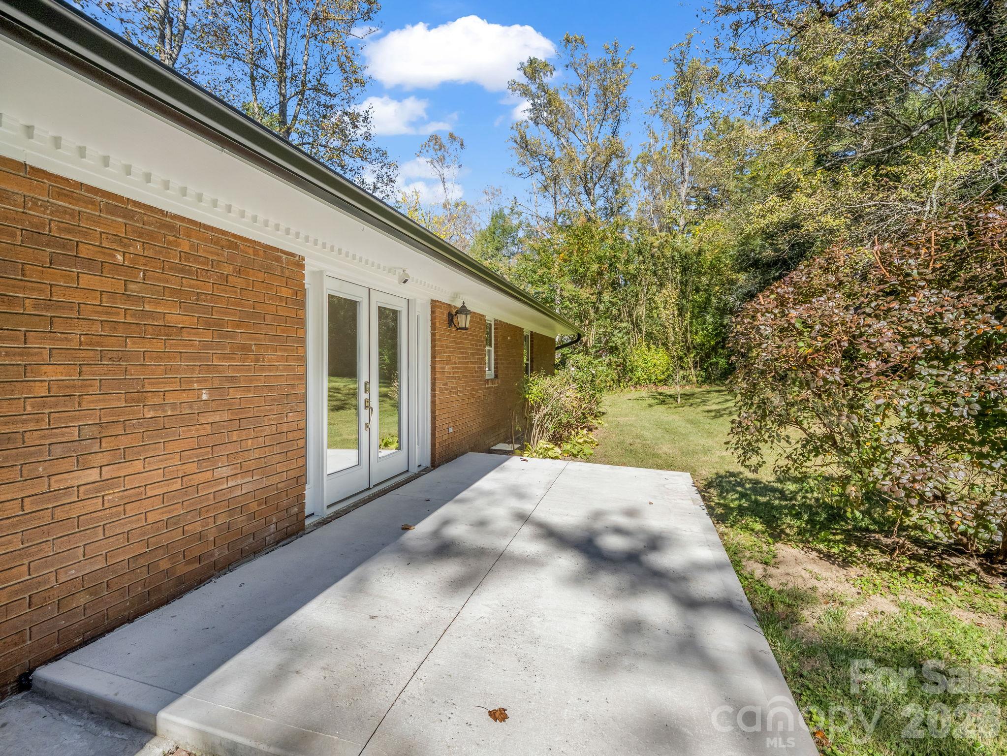 Back patio, entrance into dining room - 2630 Seminole Drive, Hendersonville