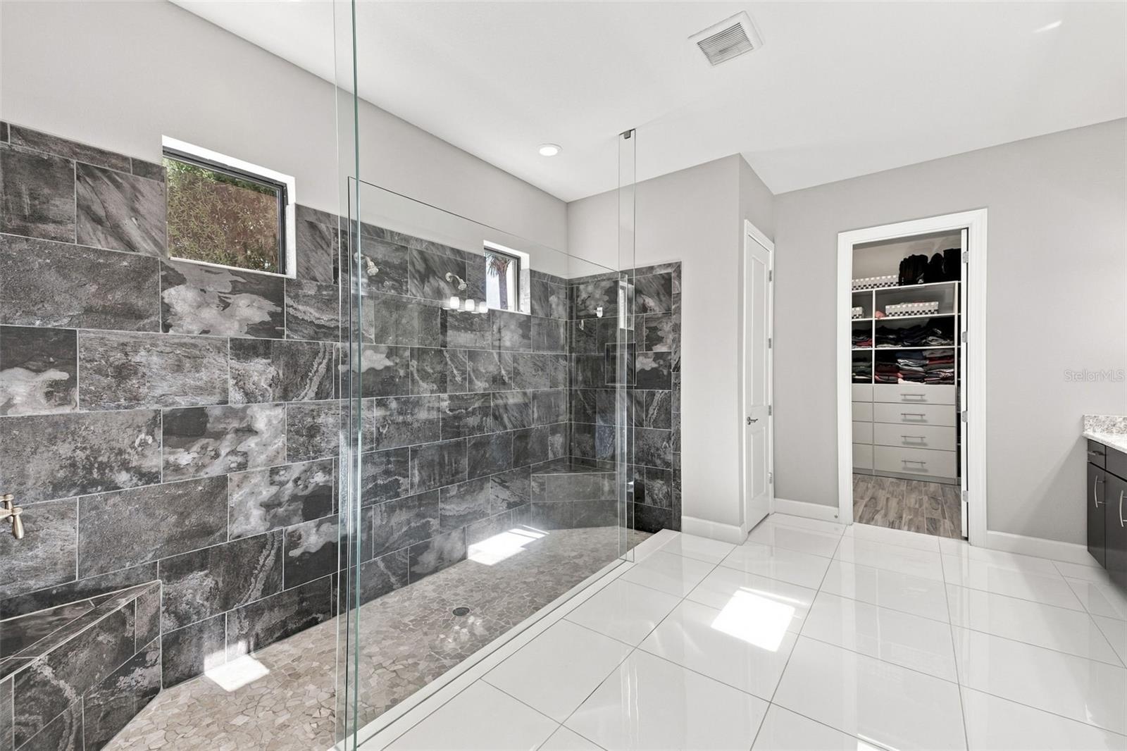 Primary Bathroom shower with dual showerheads - 4723 BENITO CT, BRADENTON