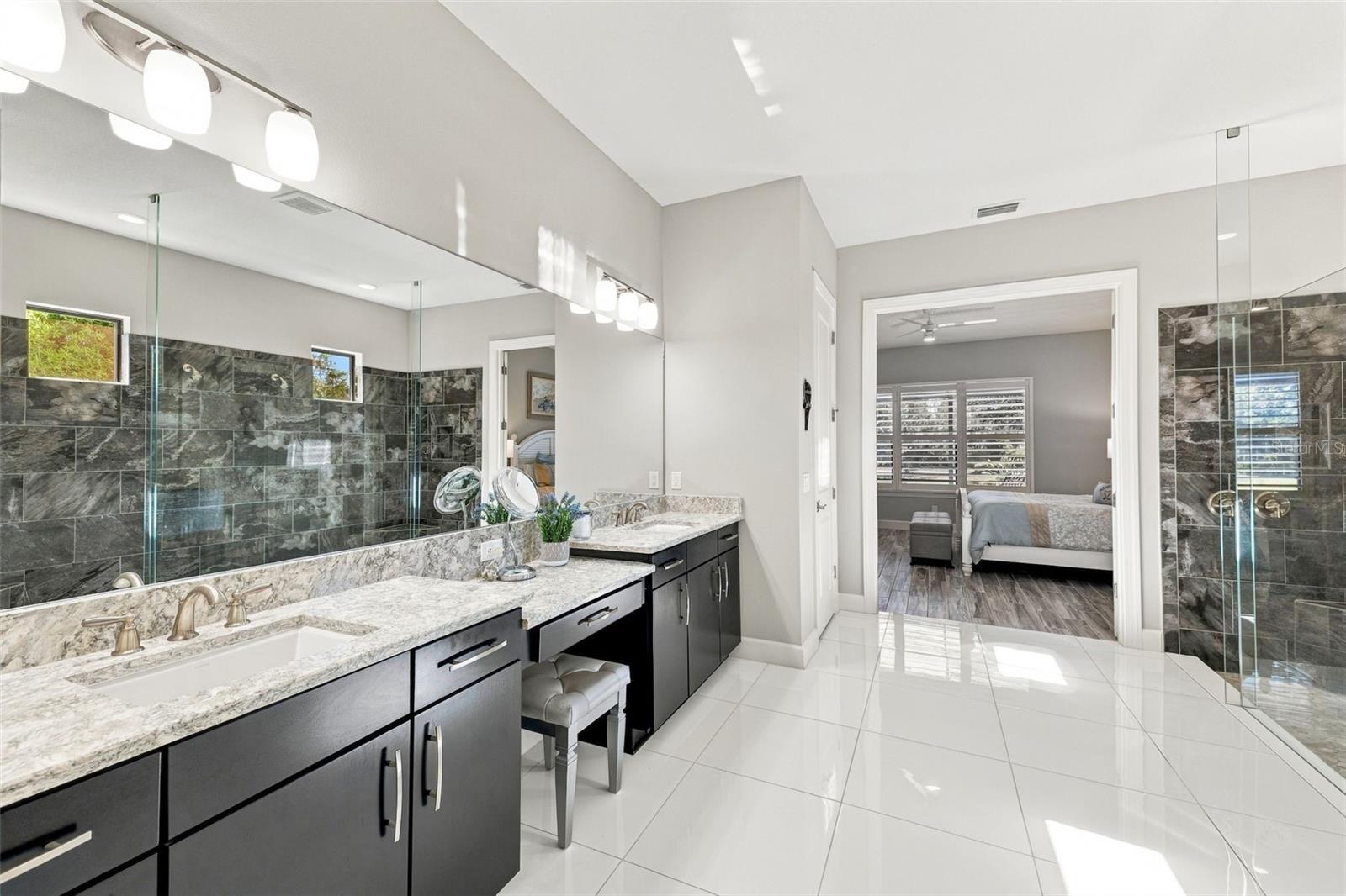 Primary Bathroom shower with dual sinks and vanity - 4723 BENITO CT, BRADENTON