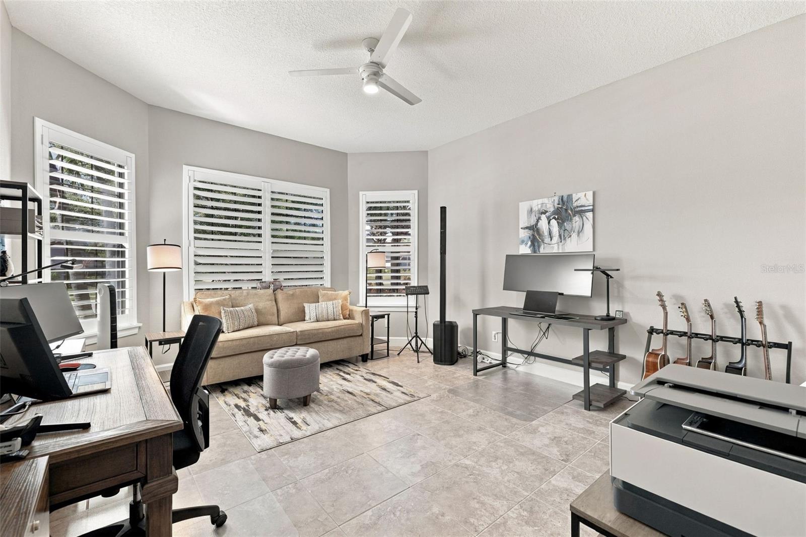 Large front Bedroom with bay window being used as an office and music room - 4723 BENITO CT, BRADENTON