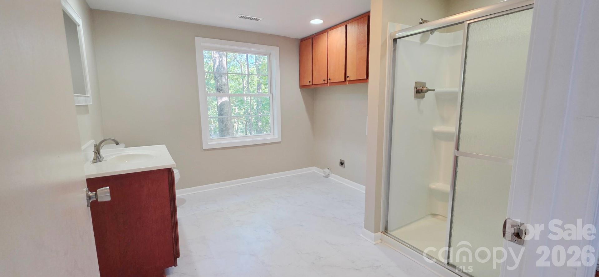 1107 Bathroom View with laundry hook ups - 1107/1111 Chase High Road, Forest City