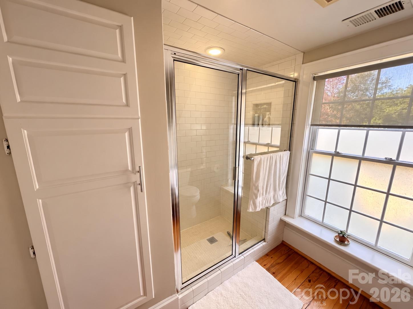 Primary bathroom with tiled walk-in shower. - 139 Louise Drive SE, Concord