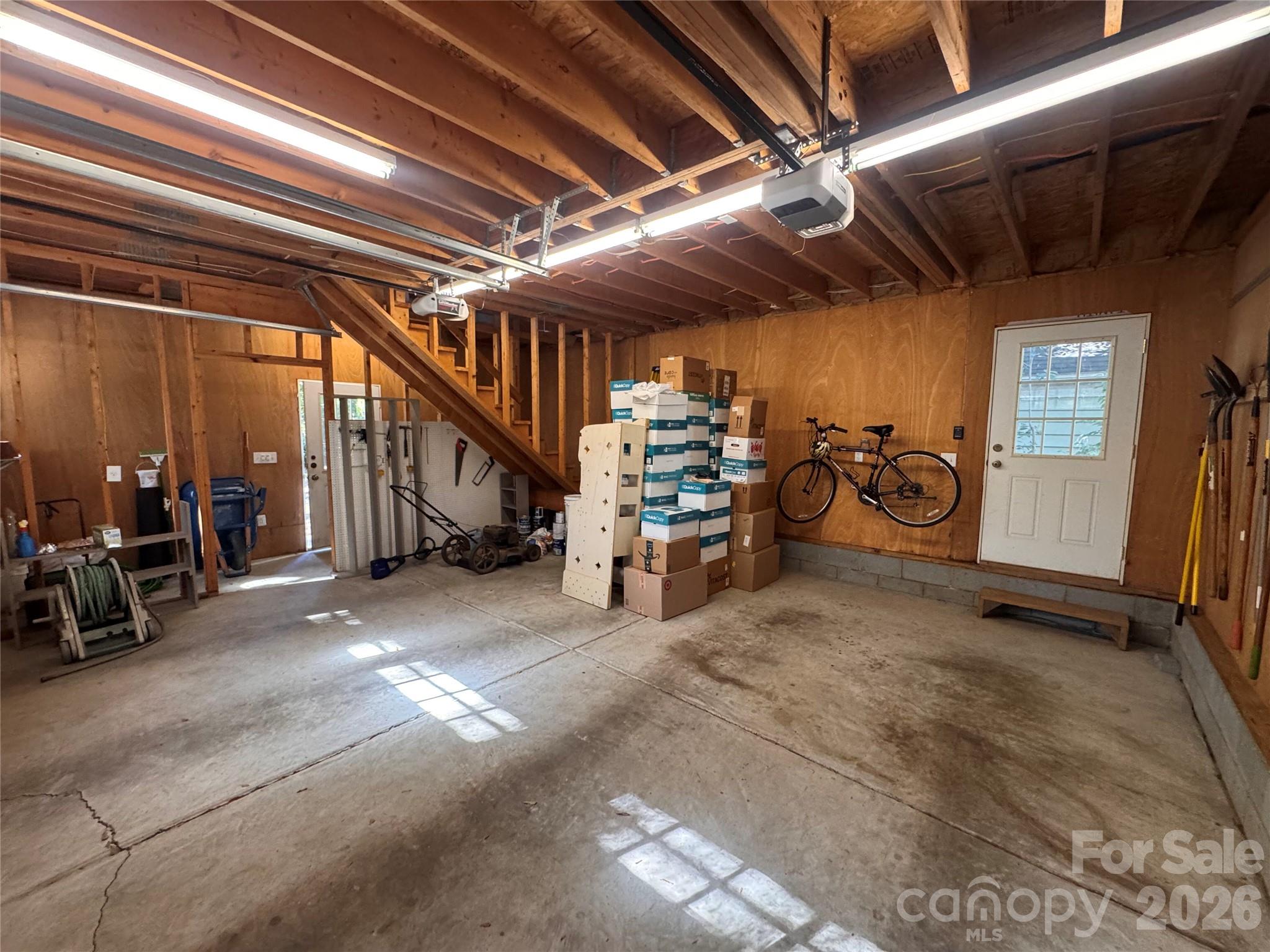 Inside garage-notice staircase to the upper level - 139 Louise Drive SE, Concord