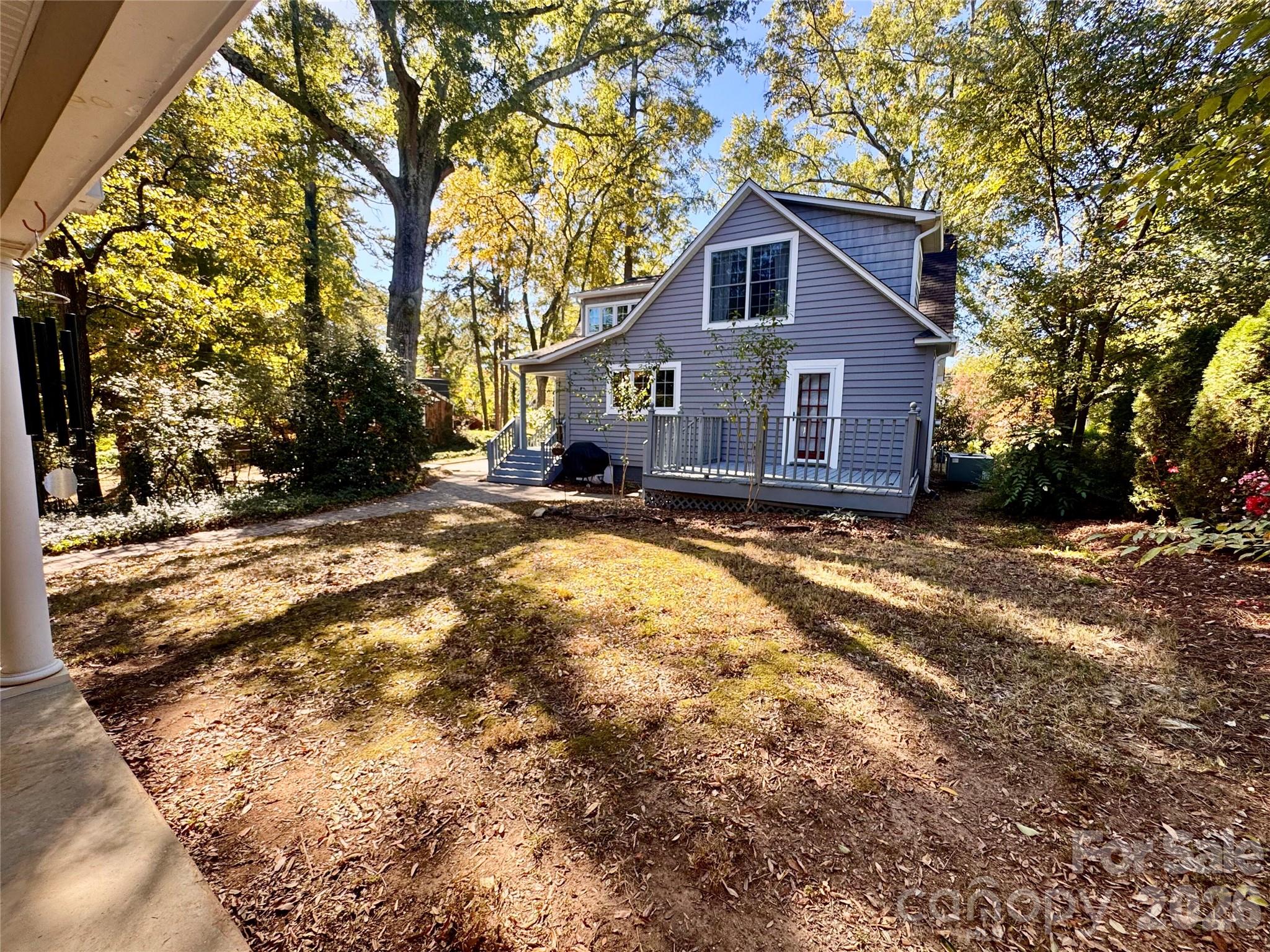 View from the garage of the backyard and back of the home. - 139 Louise Drive SE, Concord