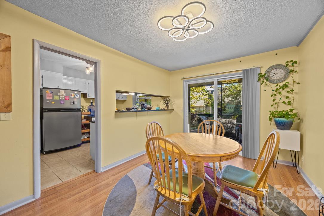 dining area towards kitchen and balcony - 2638 Park Road, Charlotte