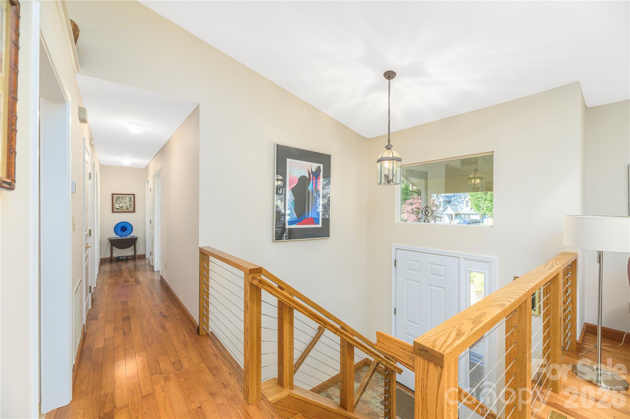 Hallway view to 3 bedrooms. Recent wood foors. - 6 Eagles Nest Lane, Asheville
