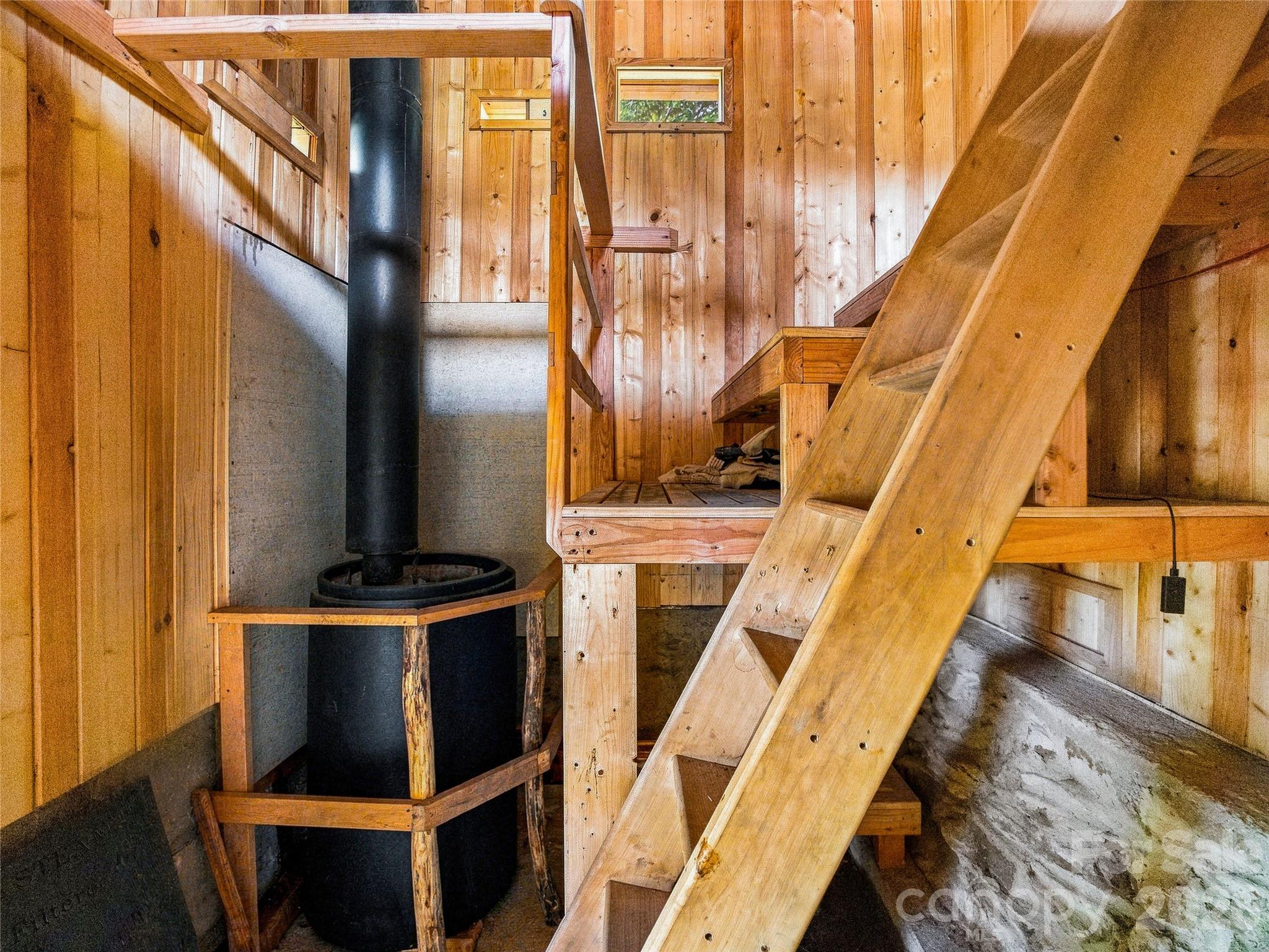 Wood fired sauna with stove access from the exterior to keep the air pure - 41 Lovin Road, Weaverville