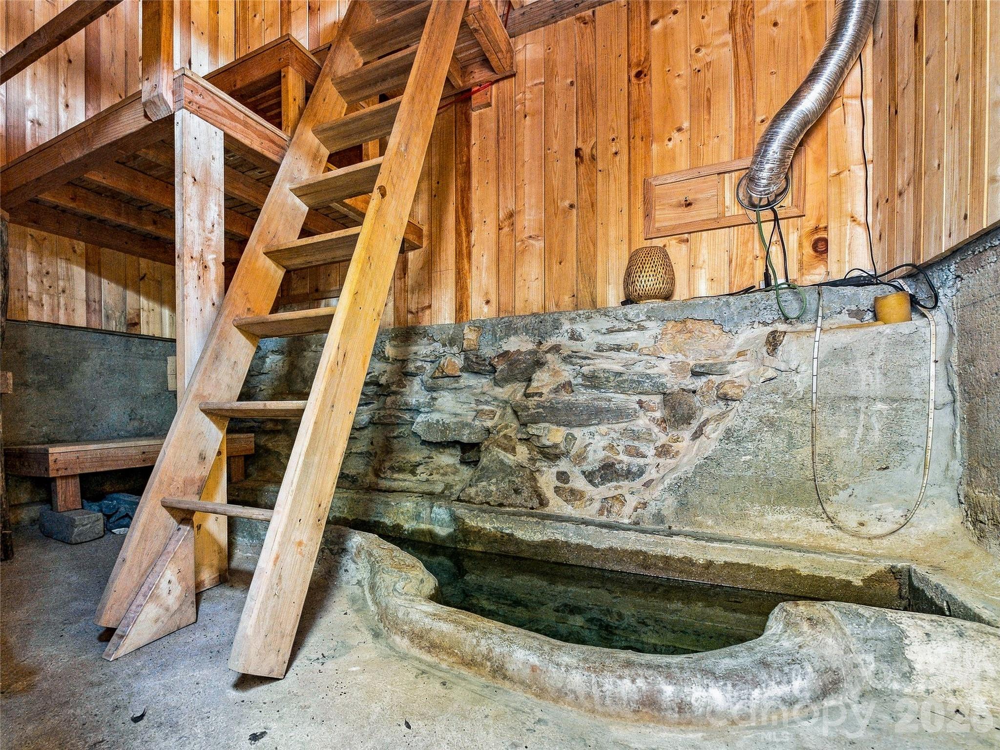 Original Farm Milk trough reused to be a spring fed cold plunge inside the sauna - 41 Lovin Road, Weaverville