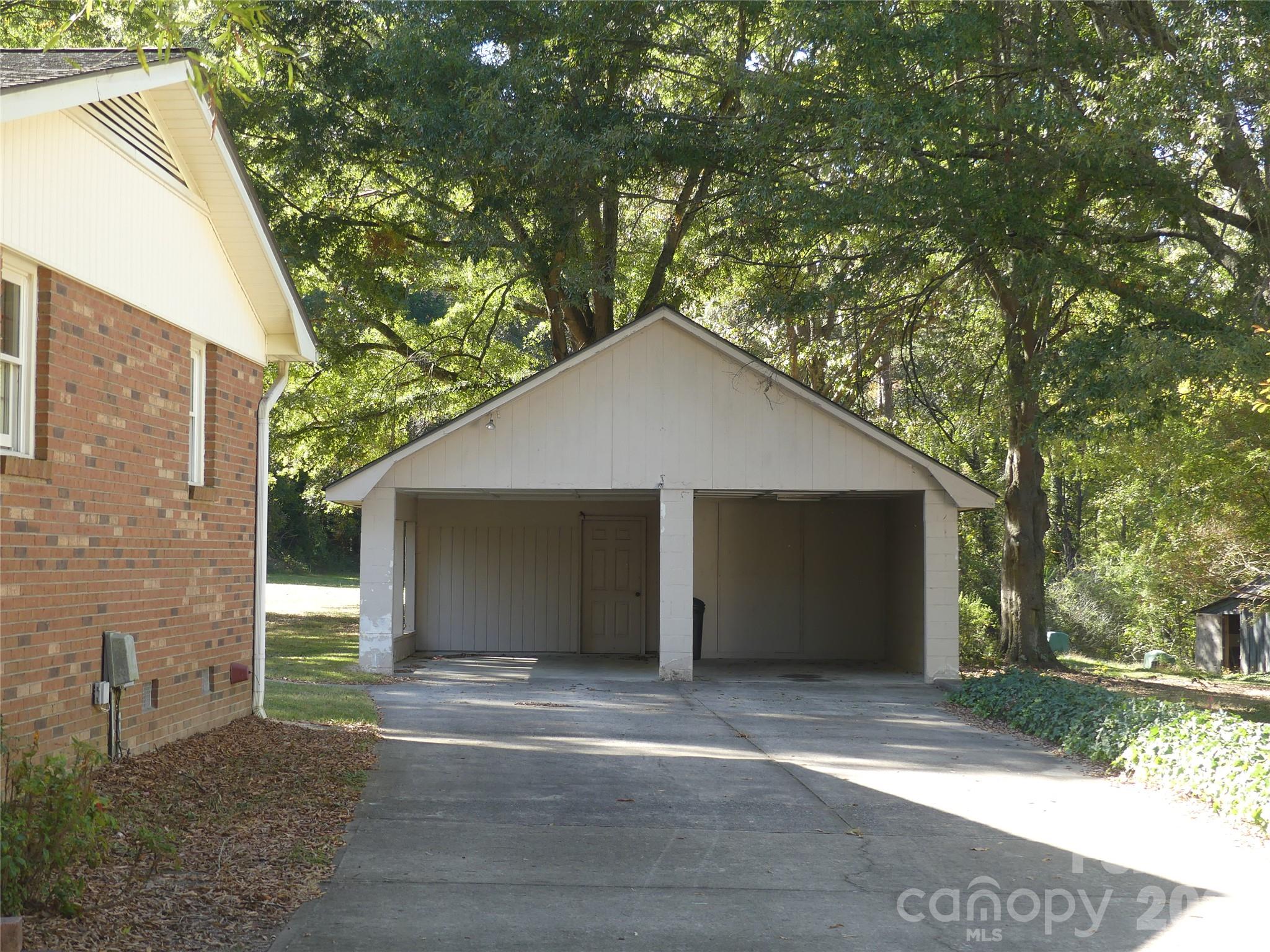 Double carport with workshop and upstairs storage. - 7871 Howard Avenue, Kannapolis