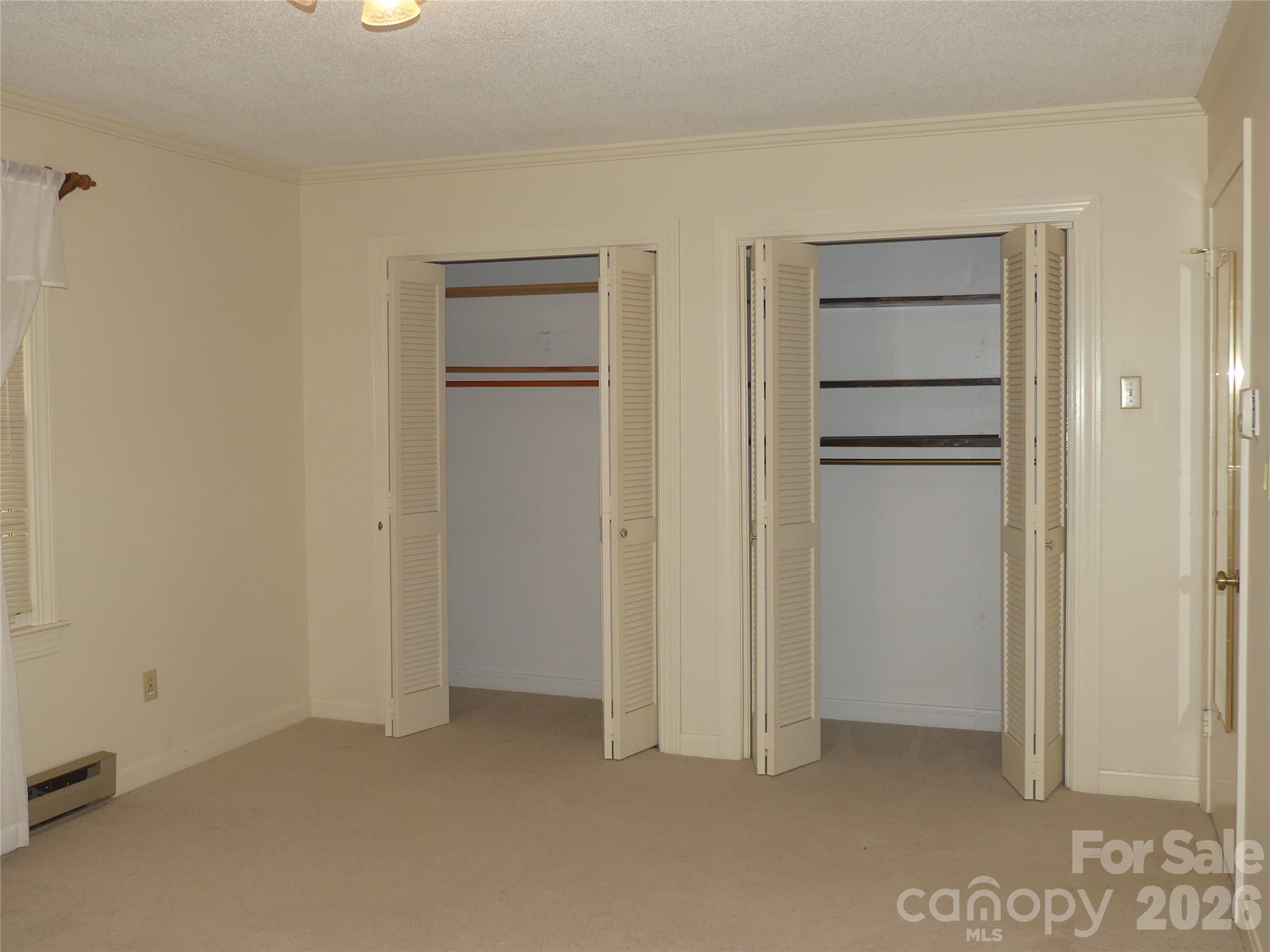 Primary bedroom closets. - 7871 Howard Avenue, Kannapolis