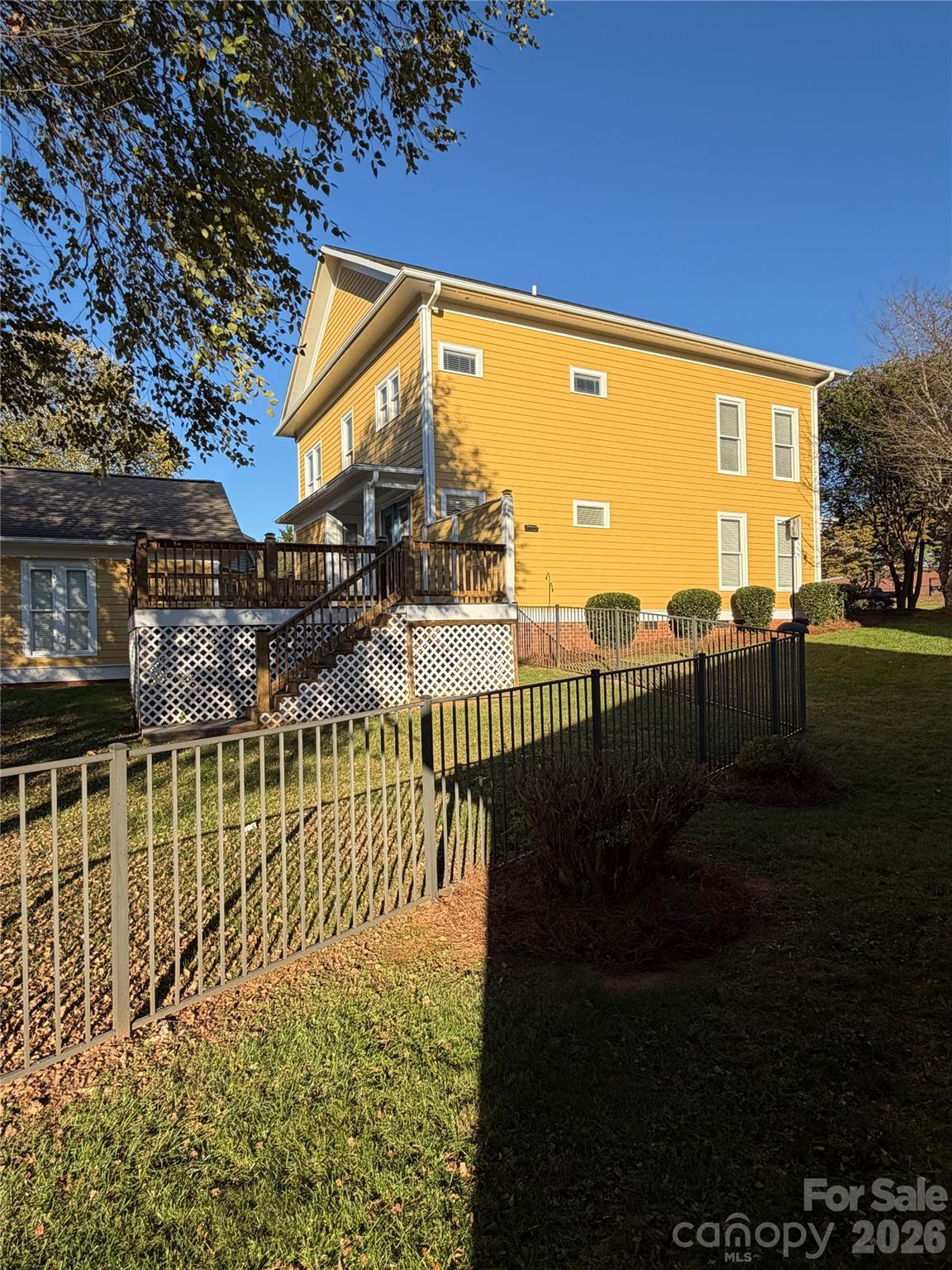 Side deck view with dual entrance and fenced in yard - 4095 Principal Circle NW, Conover