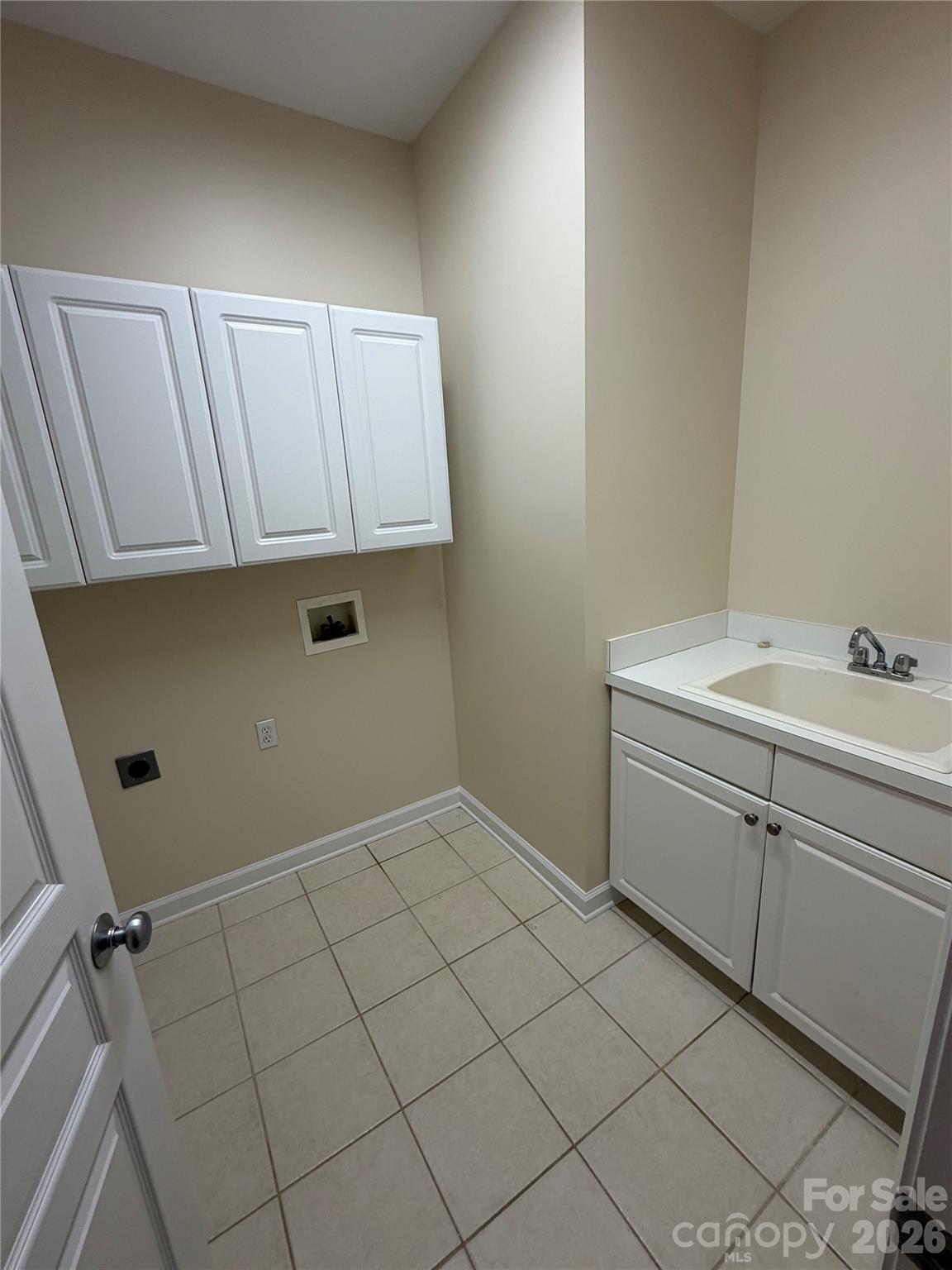 Laundry Room with built-in cabinets and sink - 4095 Principal Circle NW, Conover