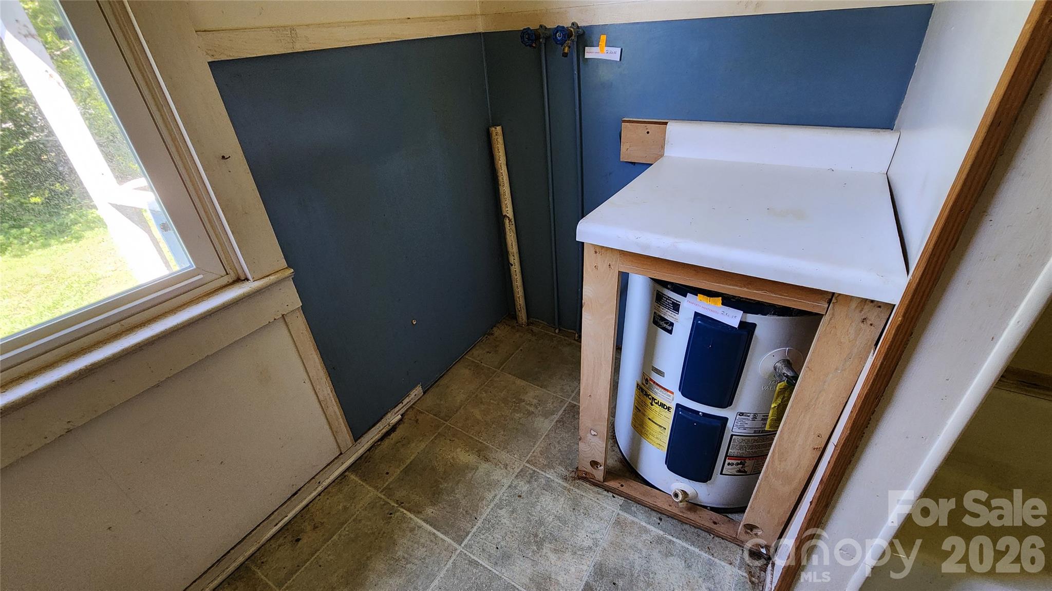 Laundry area in full bath - 6174 Hwy 221 Highway N, Marion