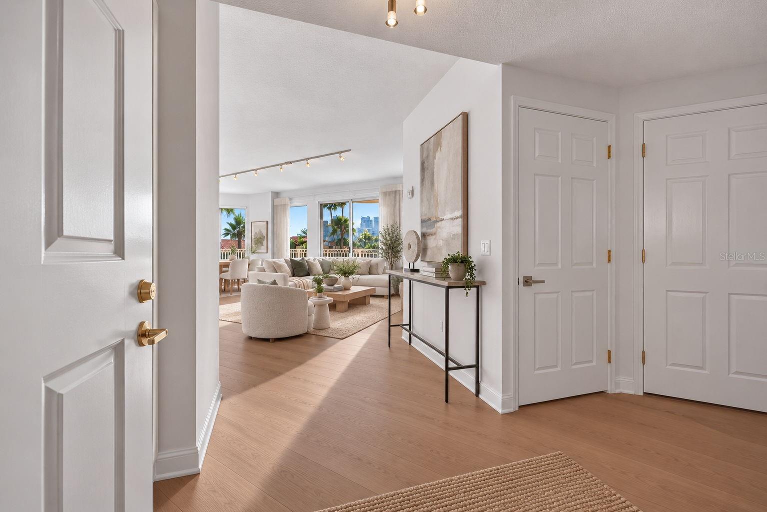 Step inside your private foyer entrance. Brand New Wood Floors throughoout. - 555 5TH AVE NE #332, ST PETERSBURG