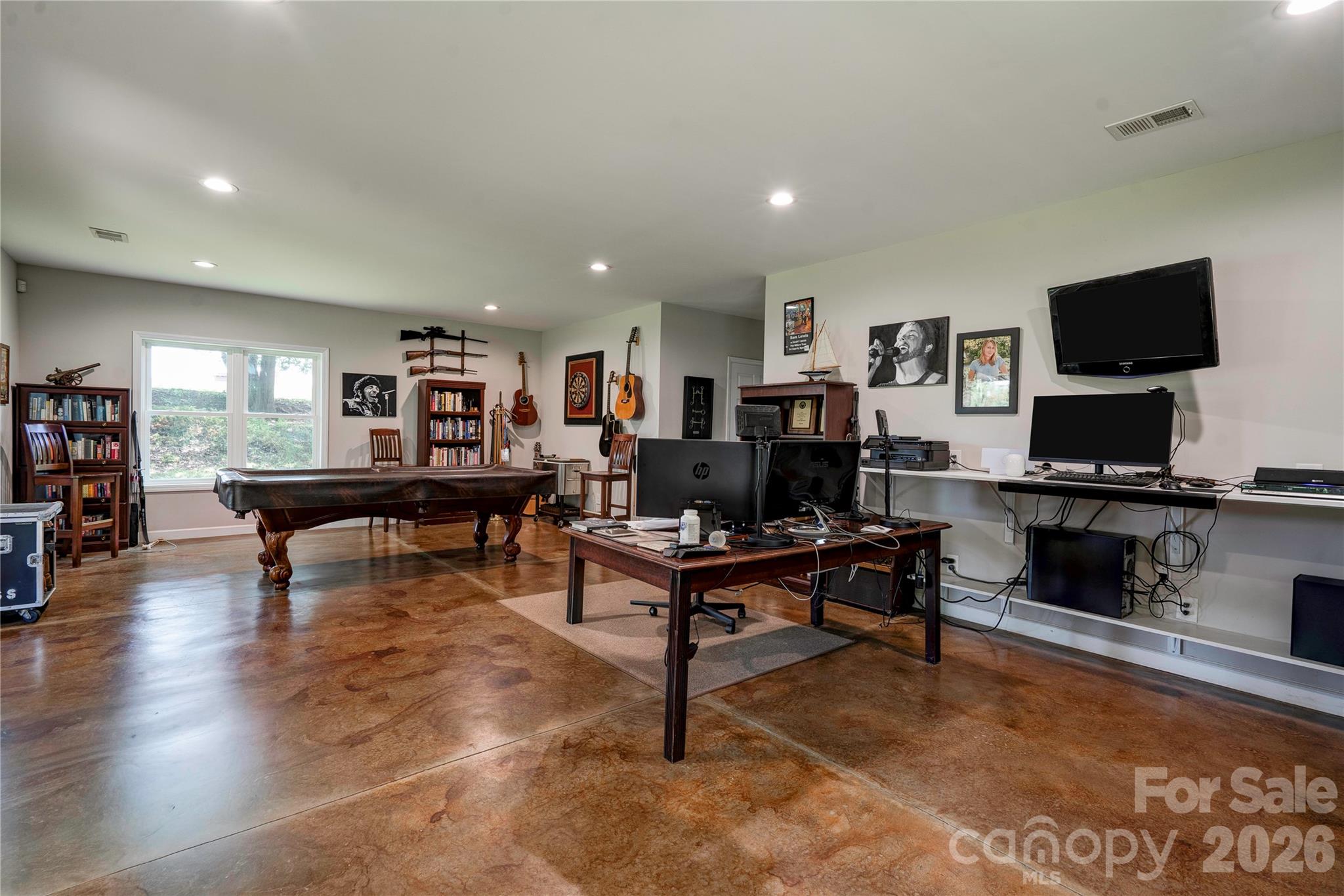Polished concrete flooring. Office gaming and living area. - 244 Randall Road, Shelby
