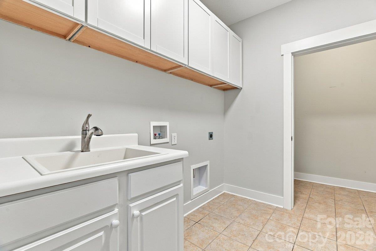 Laundry room with washer and dryer hookups and additional closet storage - 51 Westfield Way, Candler