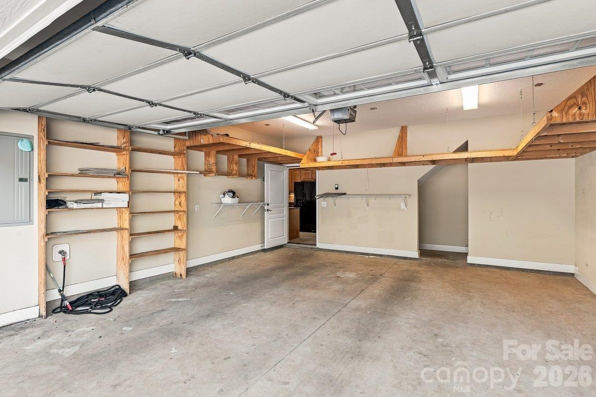 Garage with built-in shelving for storage - 51 Westfield Way, Candler