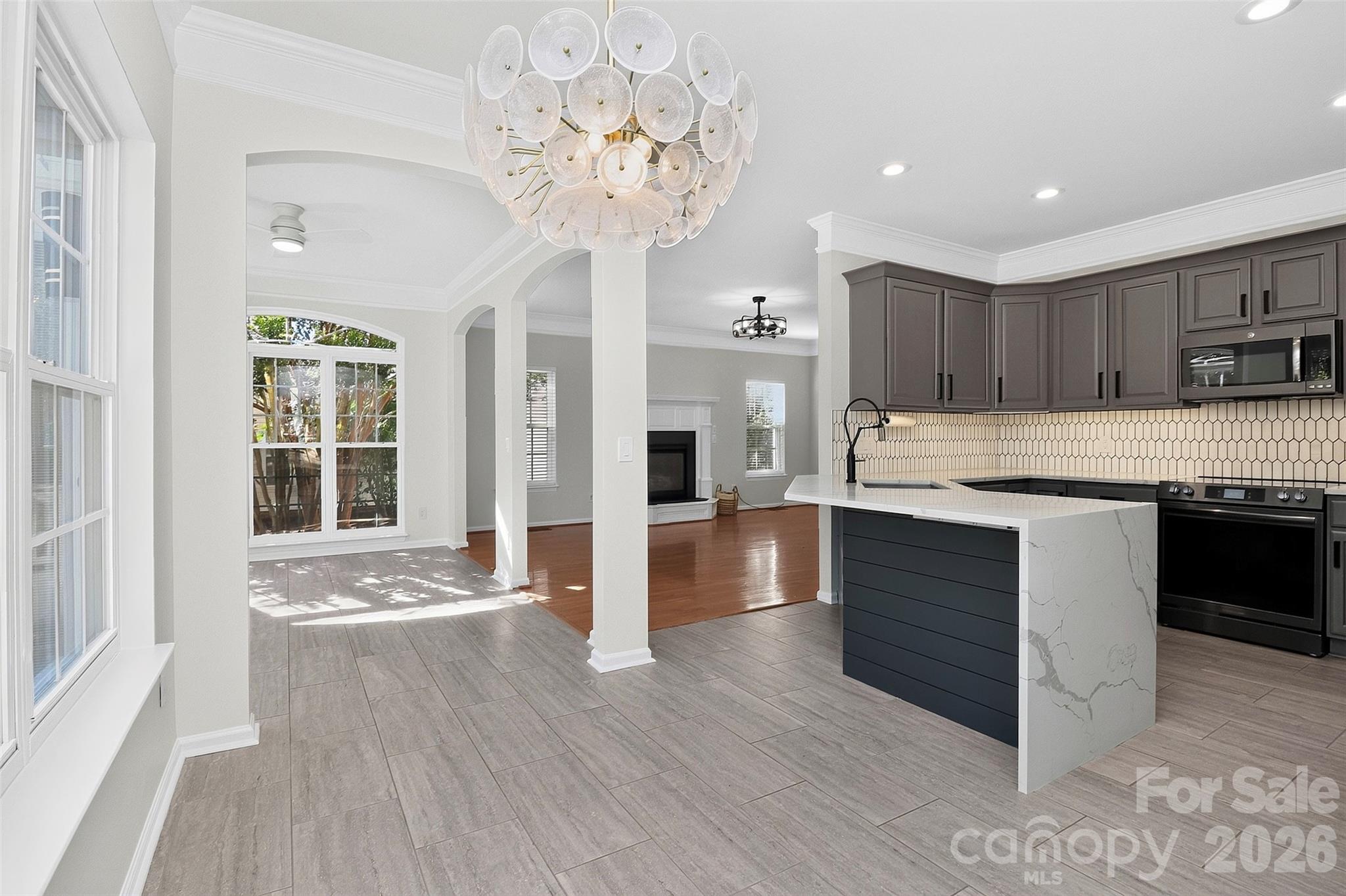 View of Sunroom and Family room from breakfast nook - 11519 Baystone Place, Concord