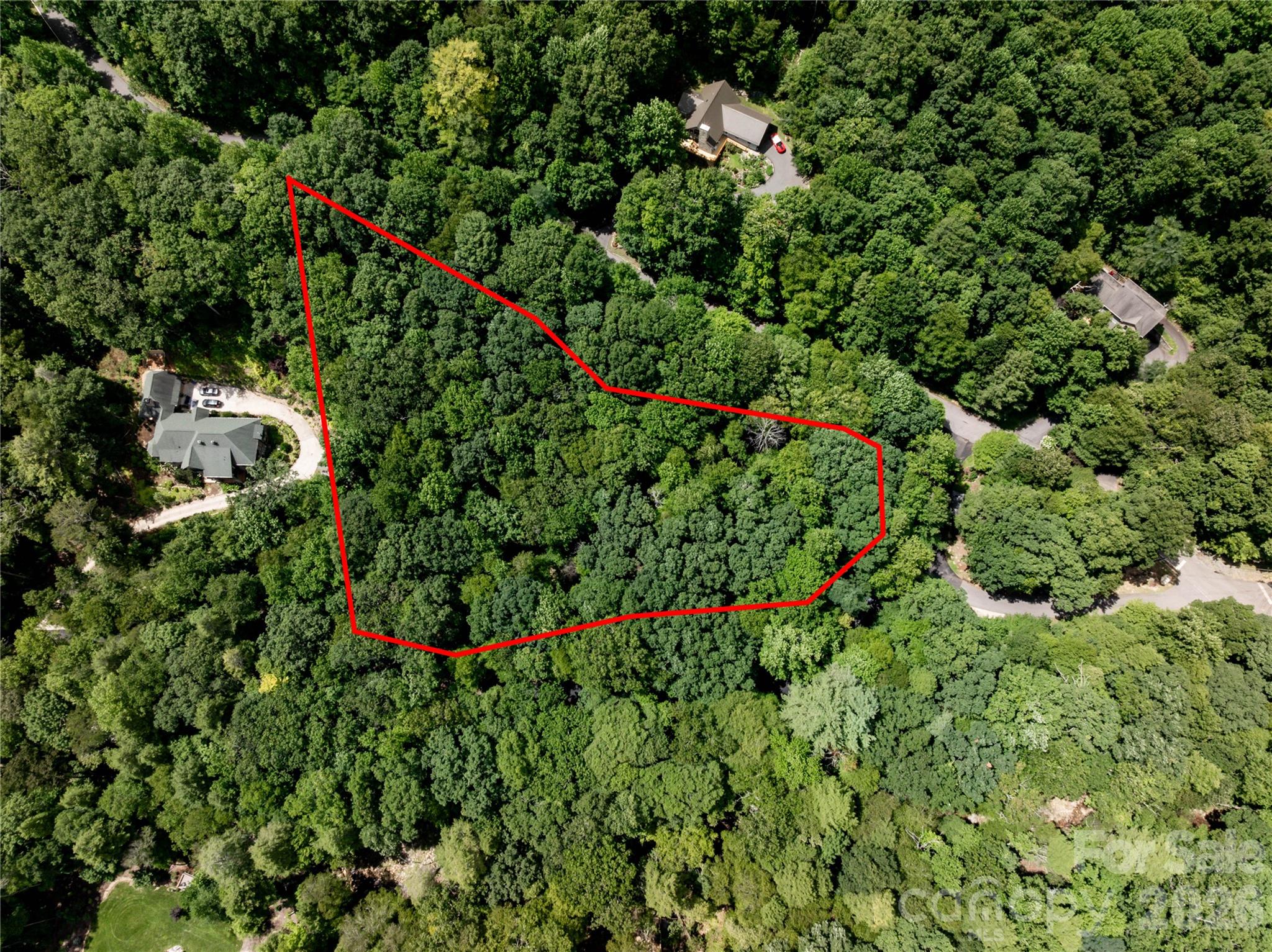 The far right side of the lot shown here from the air, is about where your driveway would enter lot 123. You'd turn left off Great Aspen Way and onto Hemlock Circle, cross the land bridge across from the mailboxes there. You would actually be on Hemlock Circle at that point and would bear right, just below the mailboxes. NOTE: if your driveway enters off of Hemlock Circle, your address would have to change from 6 Great Aspen Way. Buncombe County 911 would give you a new number and  "Hemlock Circle" as your address... - 6 Great Aspen Way, Black Mountain