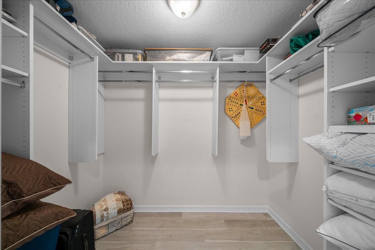Built-in Shelving Bedroom 2 Walk-in Closet - 3335 VELTRE WAY, THE VILLAGES