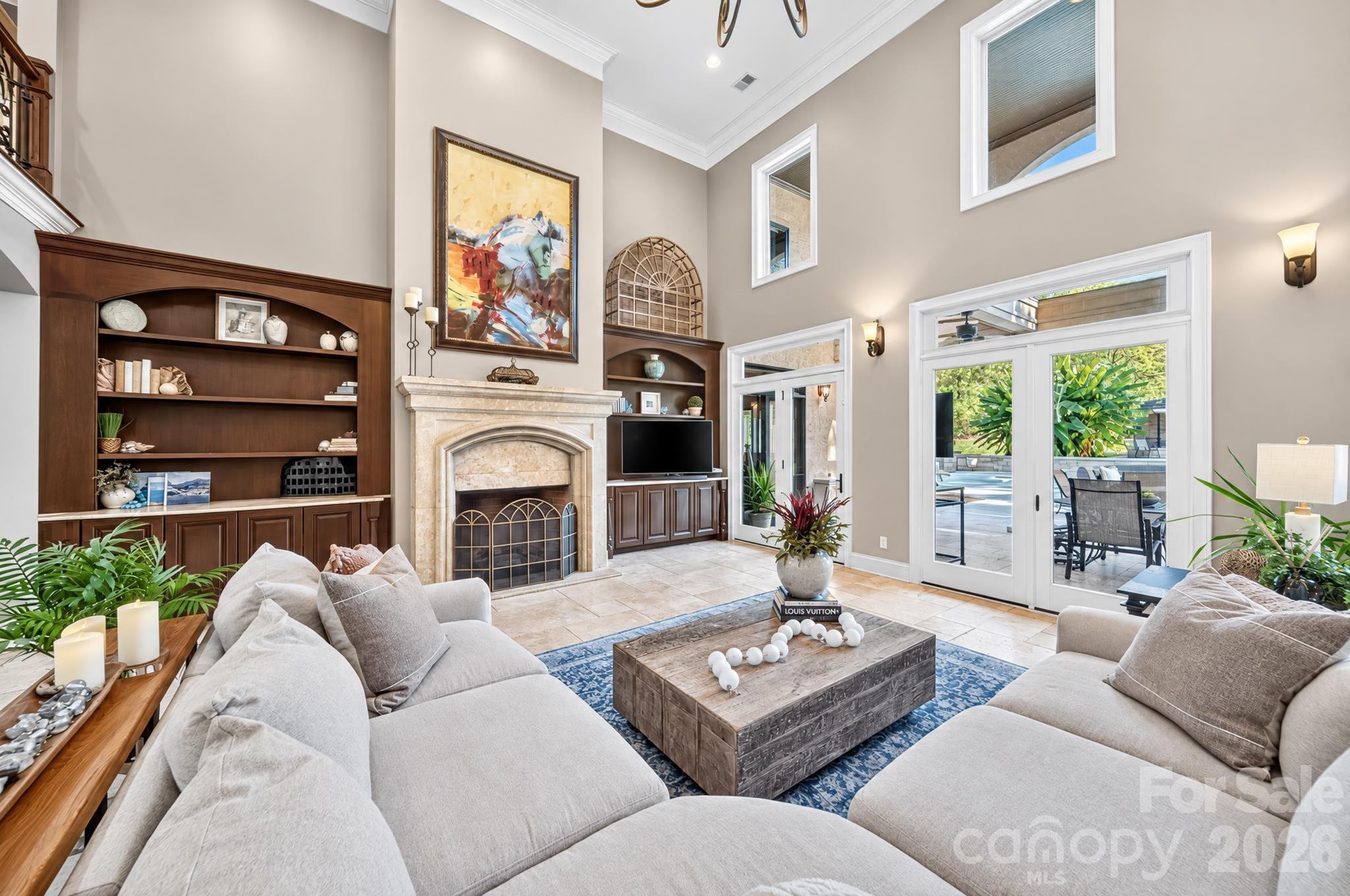 Dramatic 2 story Great Room with a firelplace and built-ins. - 1340 Sardis Road N, Charlotte