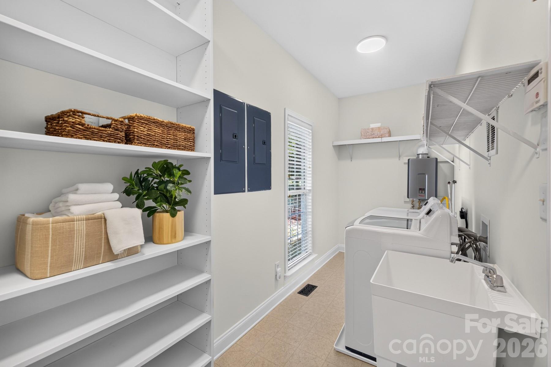 Laundry Main Floor - access from garage and walk into kitchen - 10826 Persimmon Creek Drive, Mint Hill