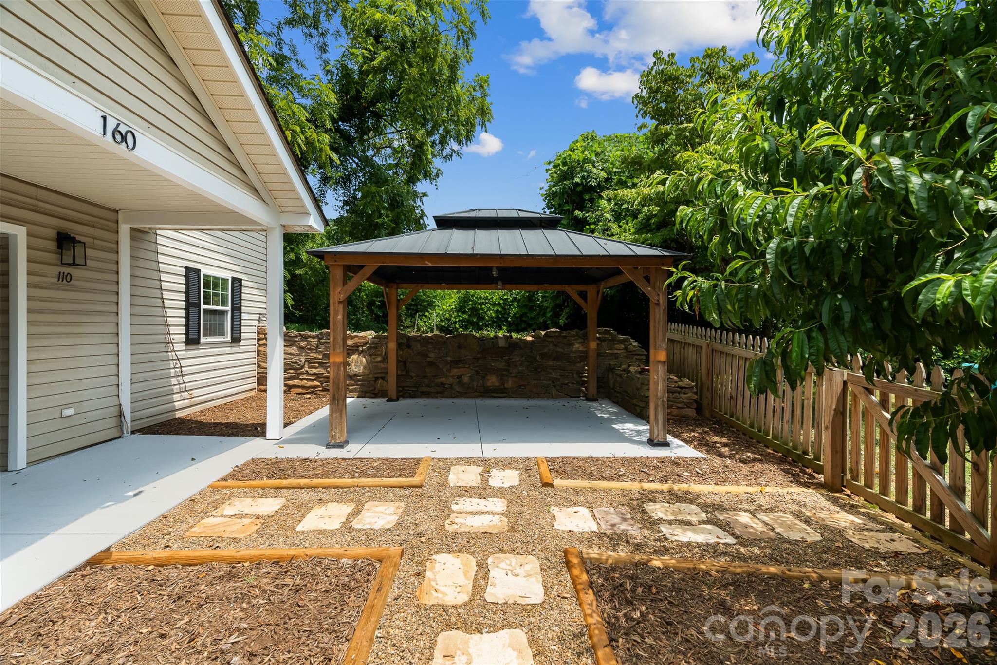 Looking to the right of the front doors towards the pergola. - 160 State Street, Asheville