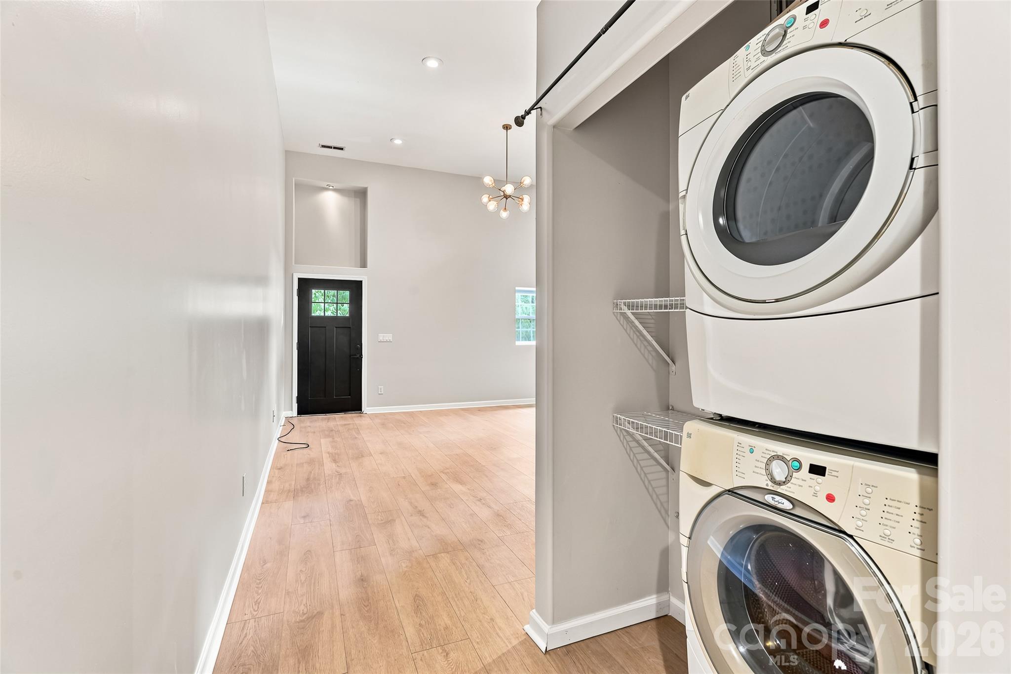 Left Side - stack washer and dryer in the hallway area. - 160 State Street, Asheville