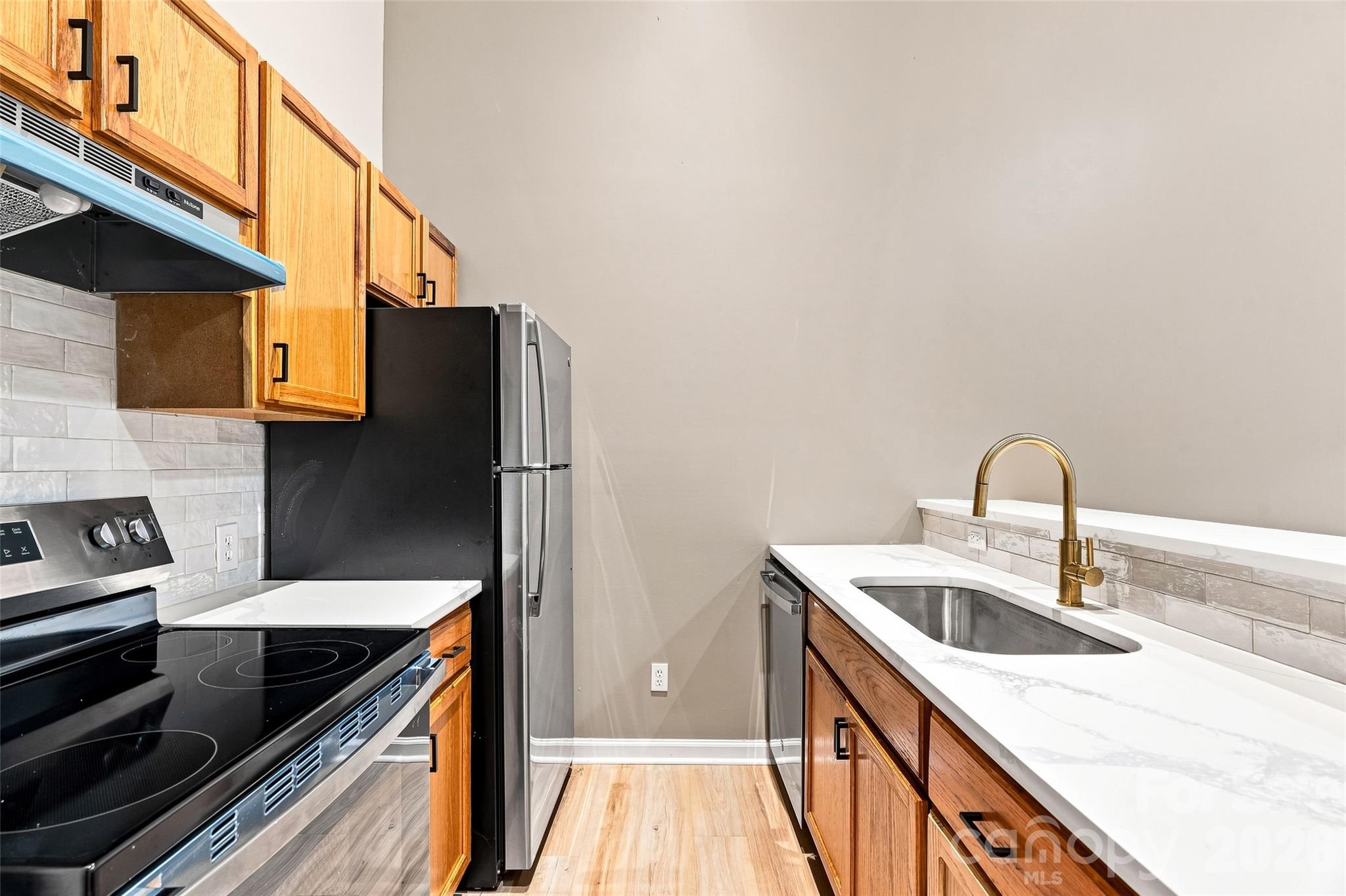Right side -  kitchen with upgraded counters, backsplash and fixtures. - 160 State Street, Asheville