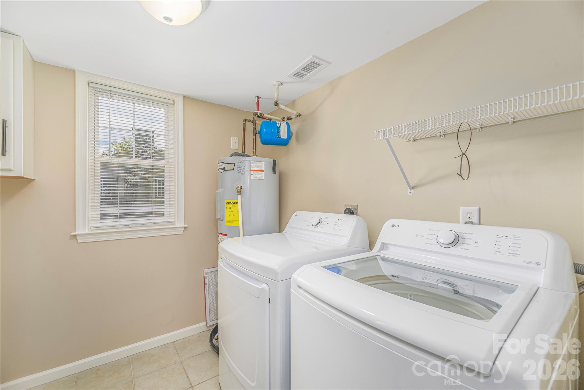 Laundry and utility room off of the kitchen in the main house. - 17 Sheridan Road, Asheville