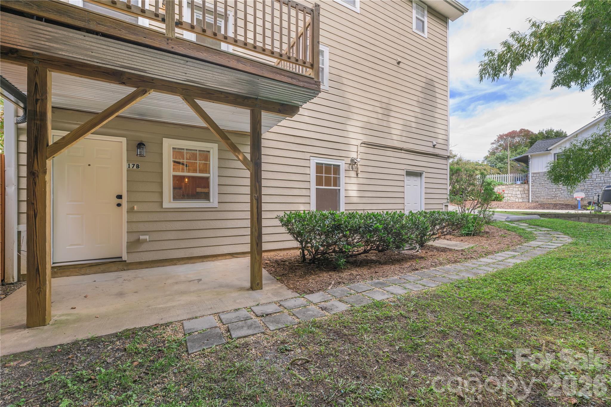 Backyard area leading to large storage room and separate one-bedroom apartment. - 17 Sheridan Road, Asheville