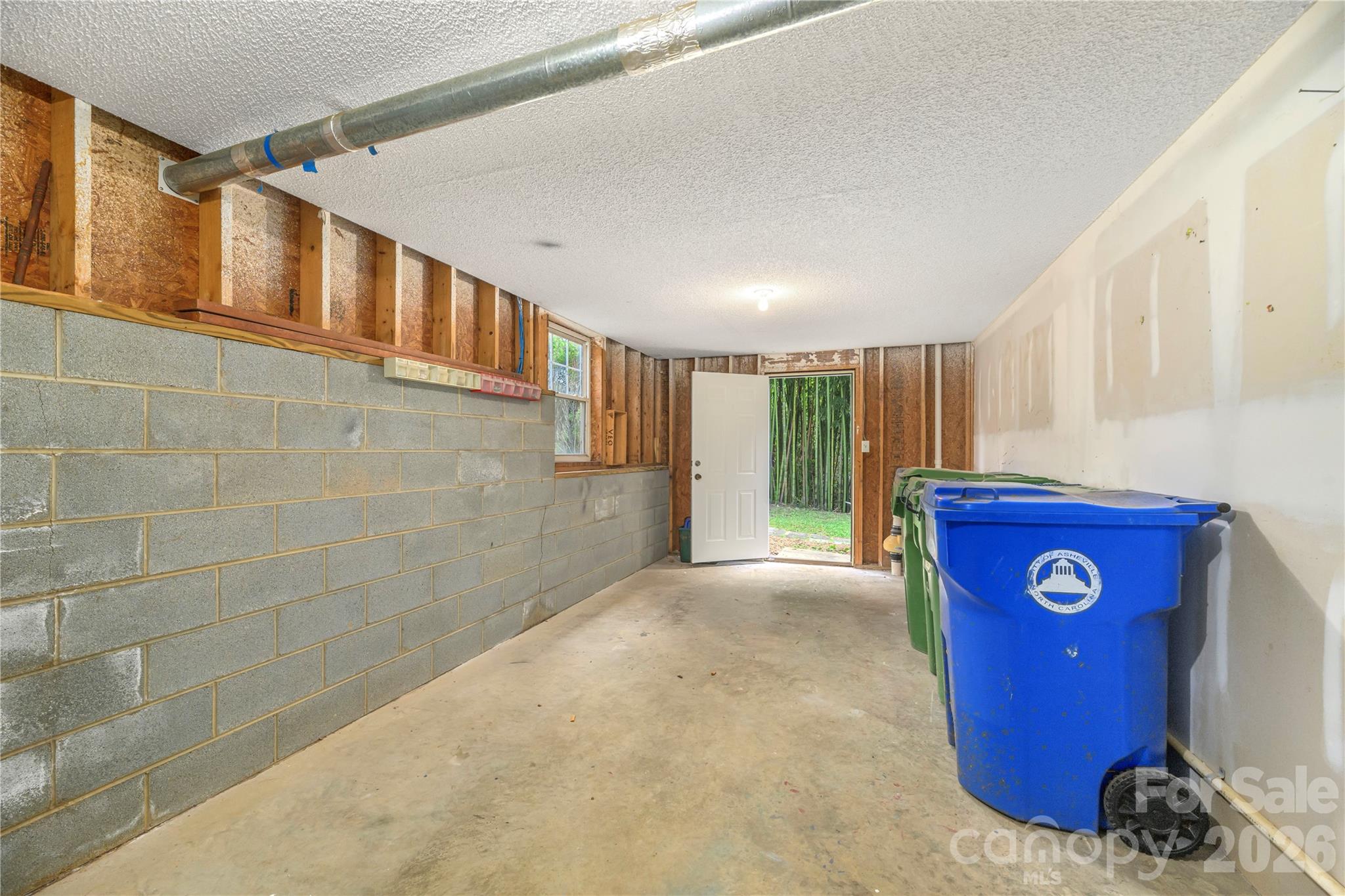 Large storage room adjacent to the basement apartment with separate entrance. - 17 Sheridan Road, Asheville