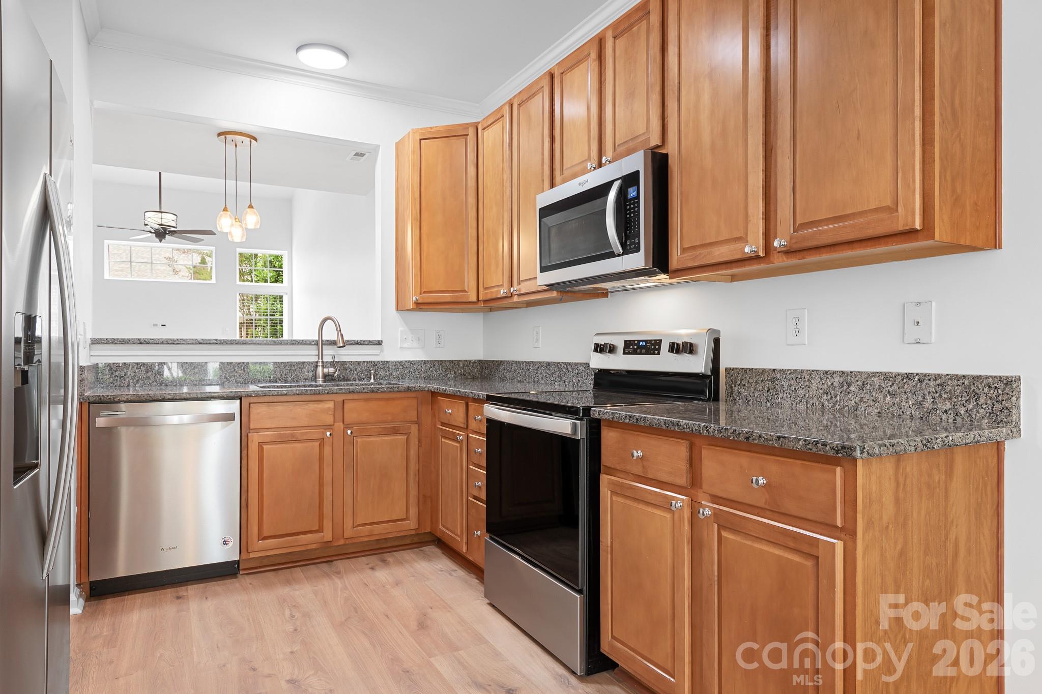 Kitchen with granite countertops, maple cabinets, stainless steel appliances - 109 Kase Court, Mooresville