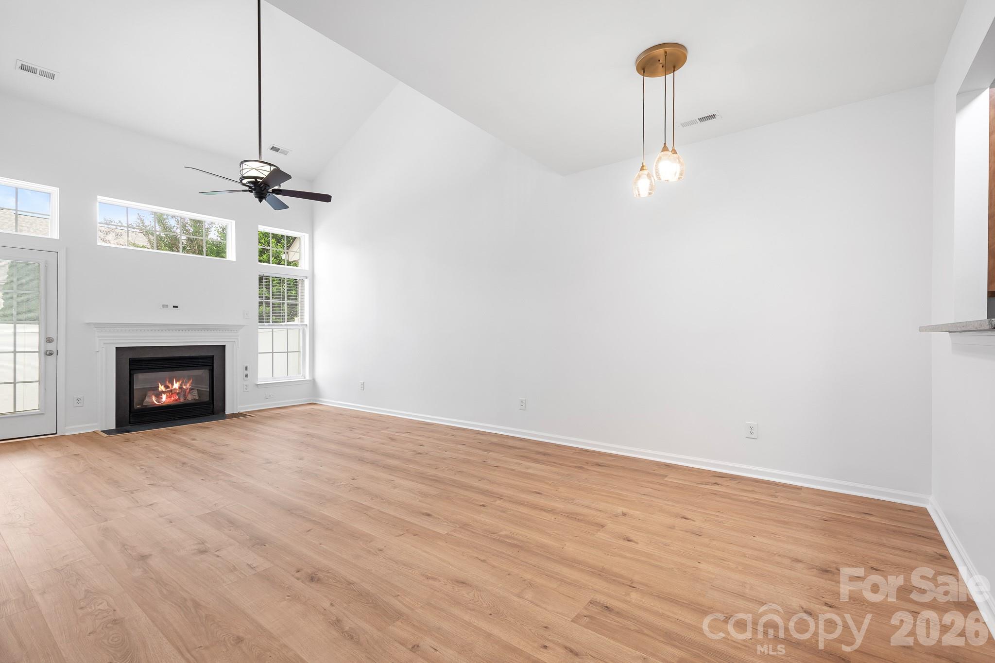 Two story Family Room with beautiful wood floors, gas fireplace - 109 Kase Court, Mooresville