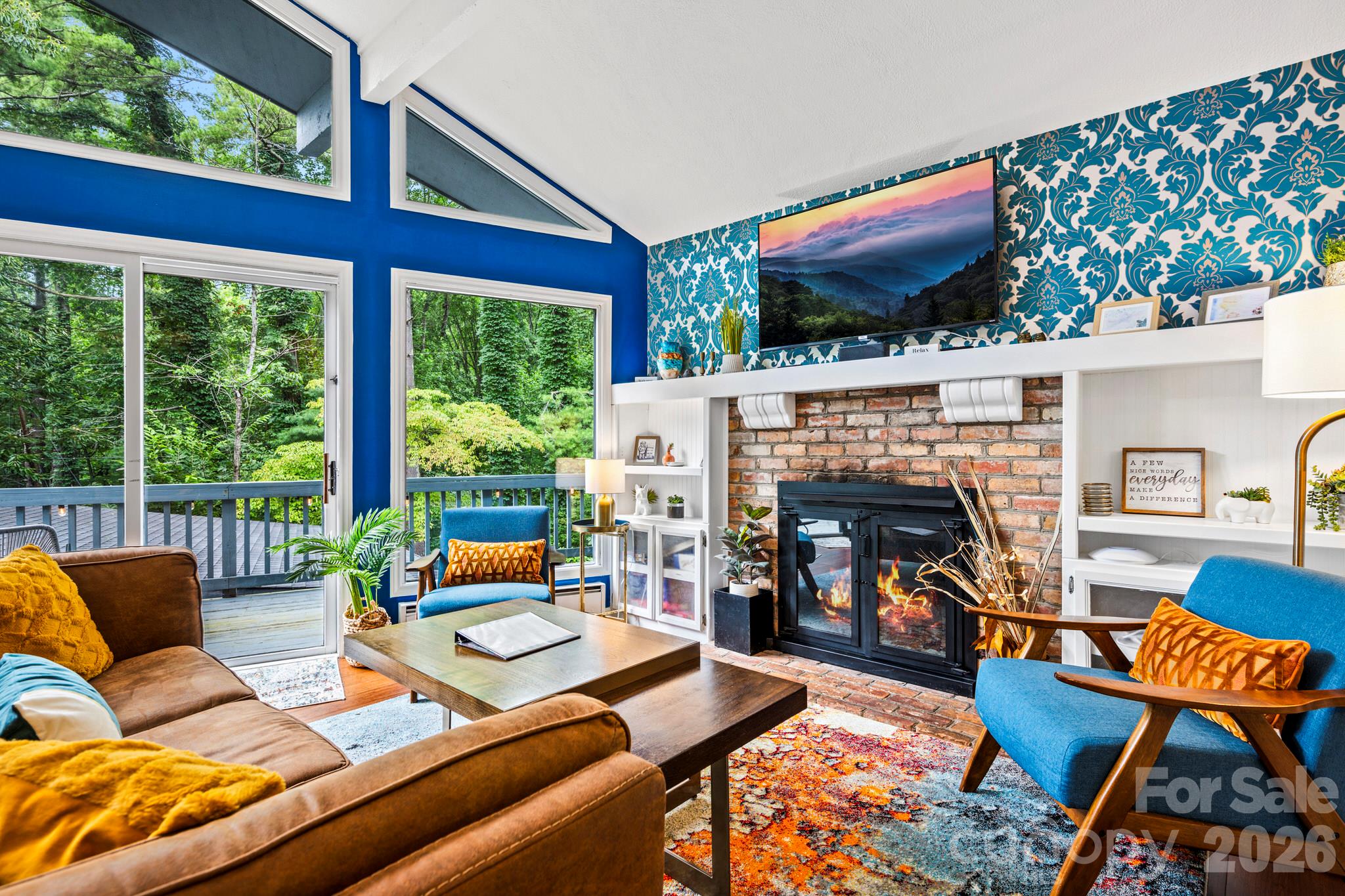 Fireplace with built in shelving - 266 Chestnut Walk Drive, Waynesville