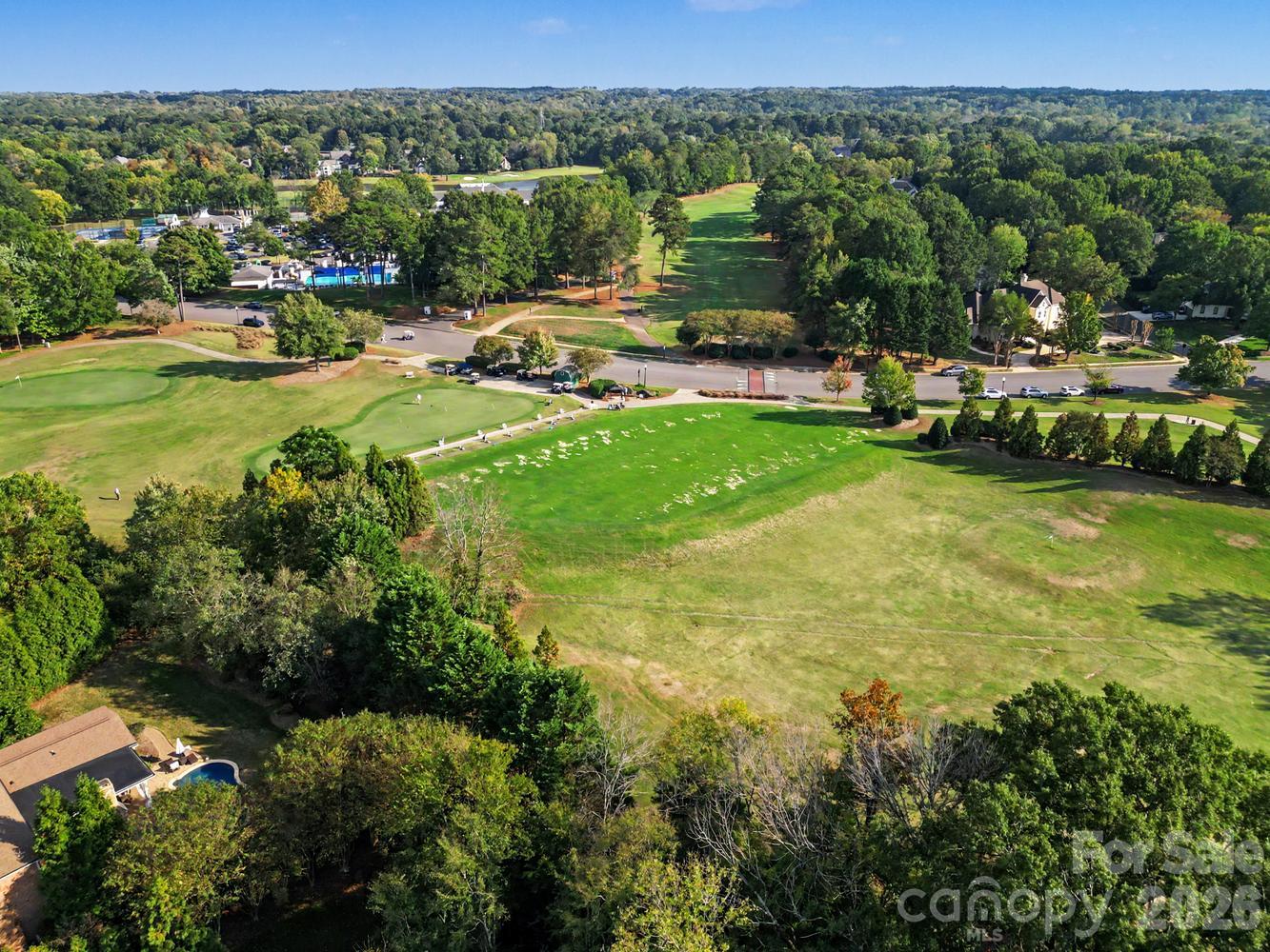 driving range behind the trees as seen from above - 6325 County Donegal Court, Charlotte