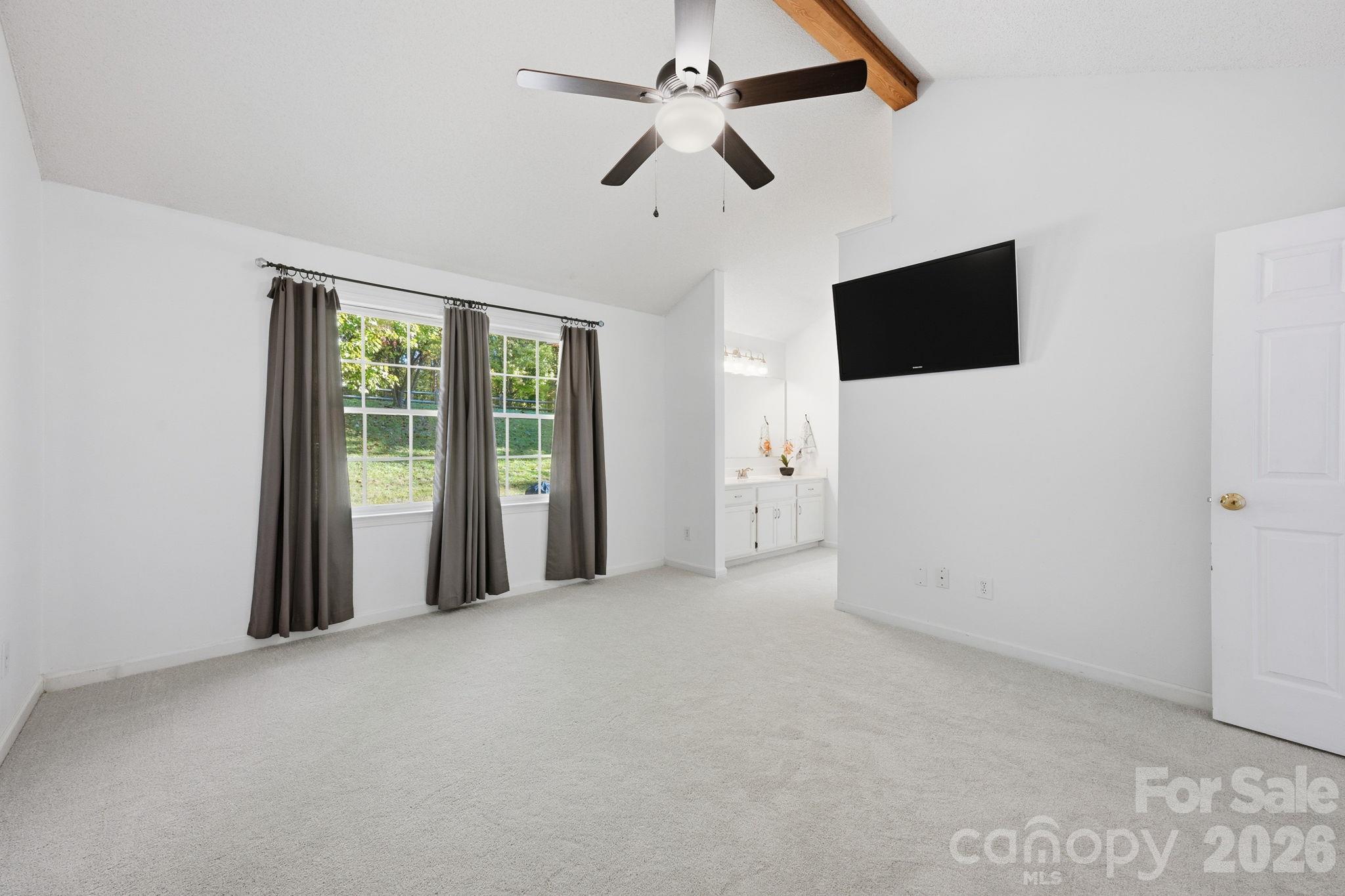 Primary Bedroom with Vaulted Exposed-Beam Ceiling - 12807 Levins Hall Road, Huntersville