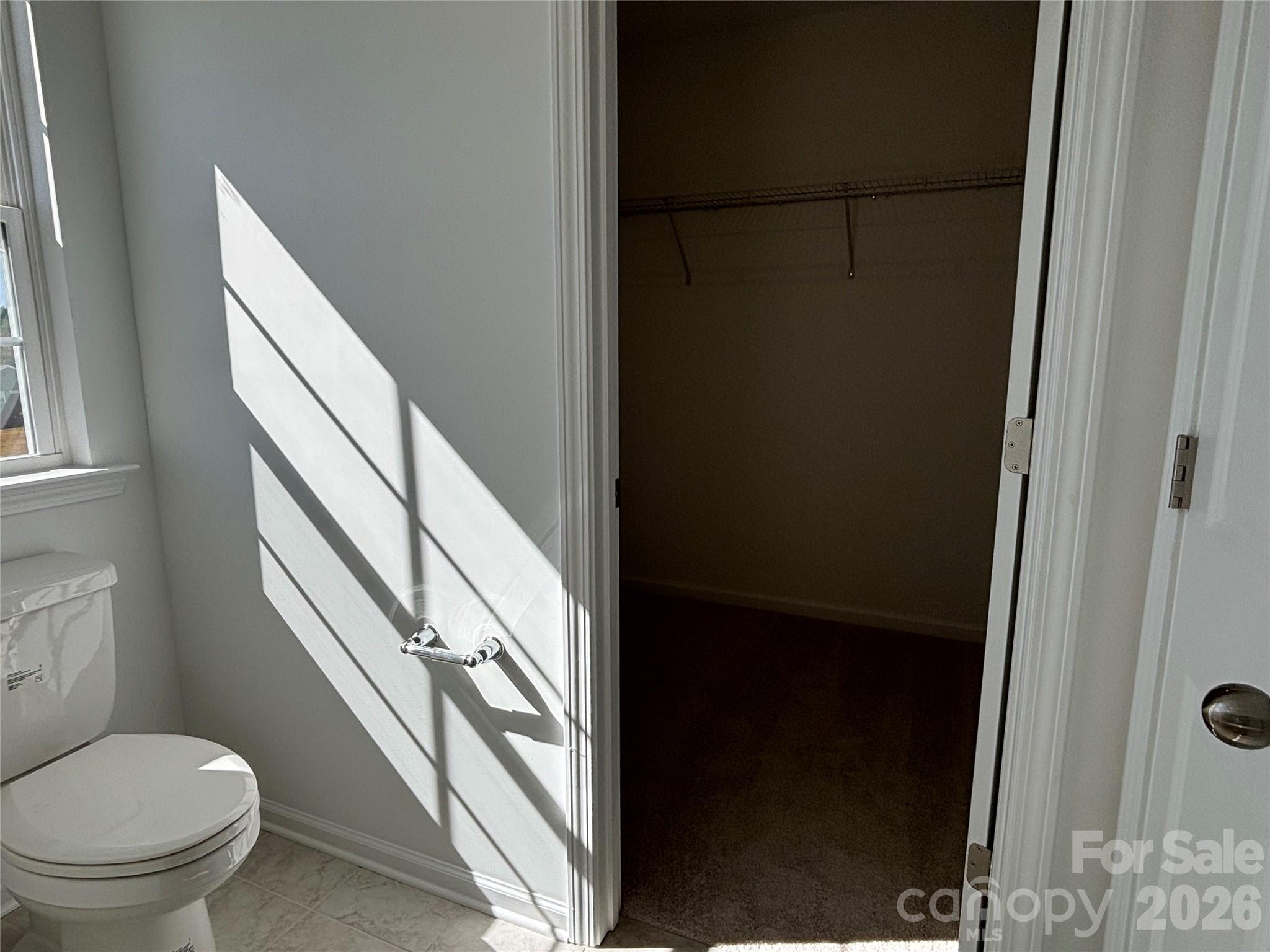 It may look dark in the primary closet but you will light up when you see it in person ! - 1645 Grassy Knoll Trail, Maiden