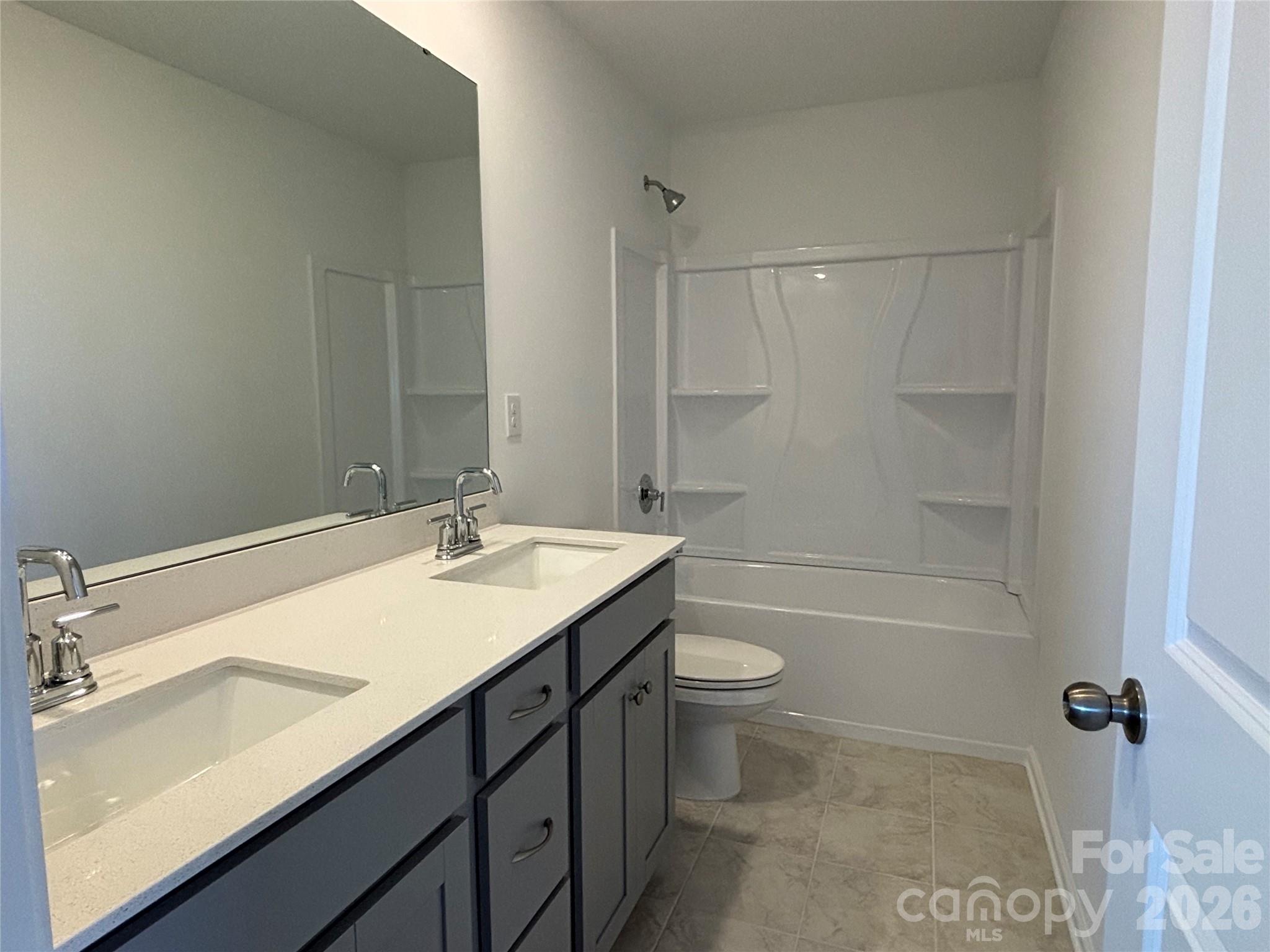 Double sinks in the secondary bathroom... included! - 1645 Grassy Knoll Trail, Maiden