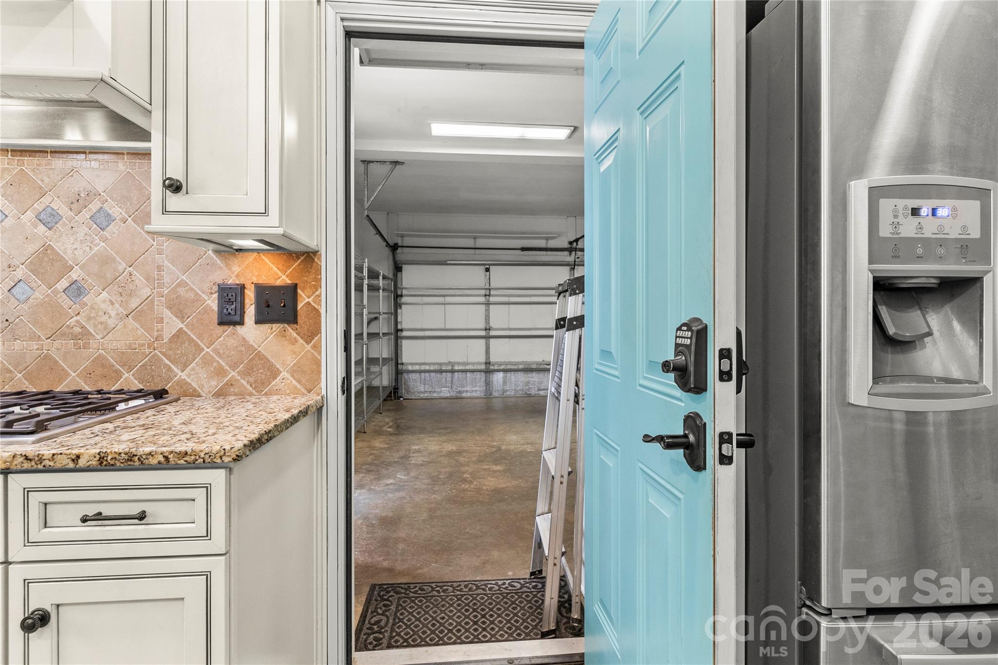 Garage access point from kitchen area. - 635 Highland Ridge Road, Mooresville