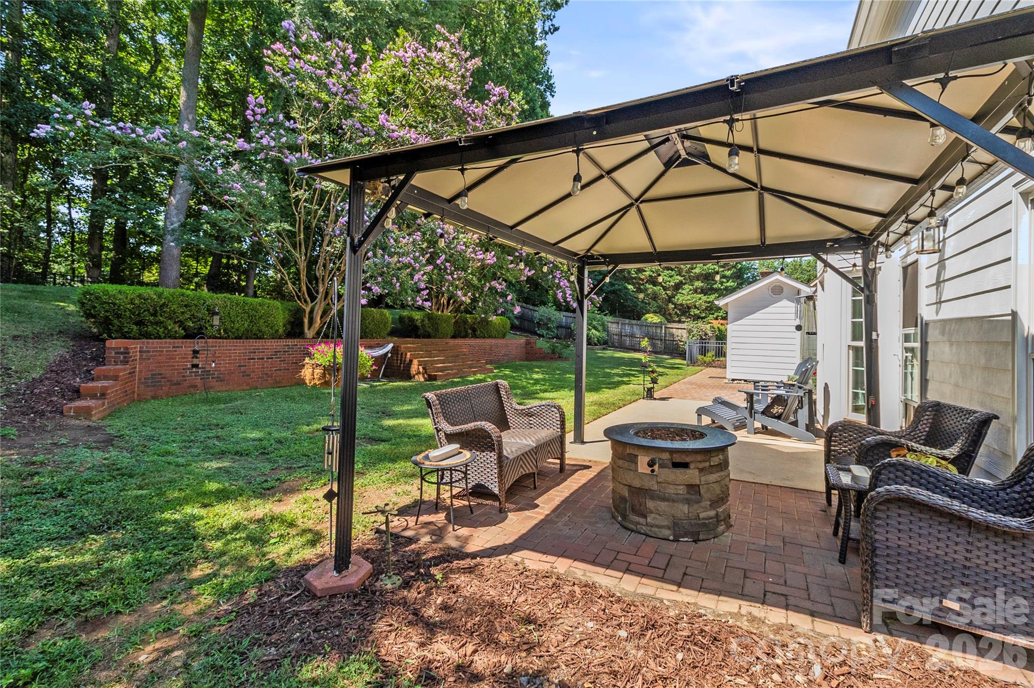 Beautiful brick walling to create a peaceful backyard getaway. - 635 Highland Ridge Road, Mooresville